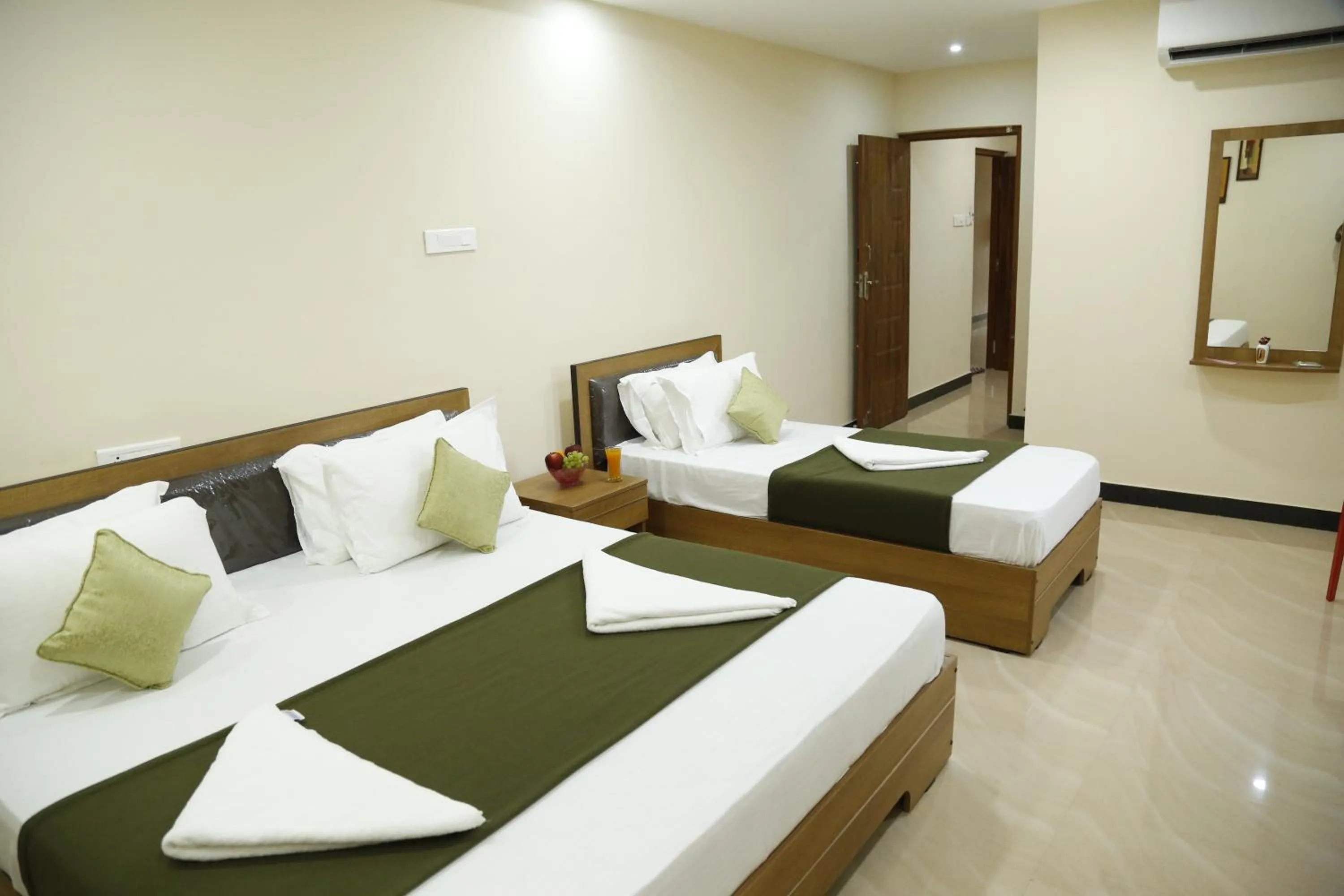 Bedroom in Hotel New Amirtham inn