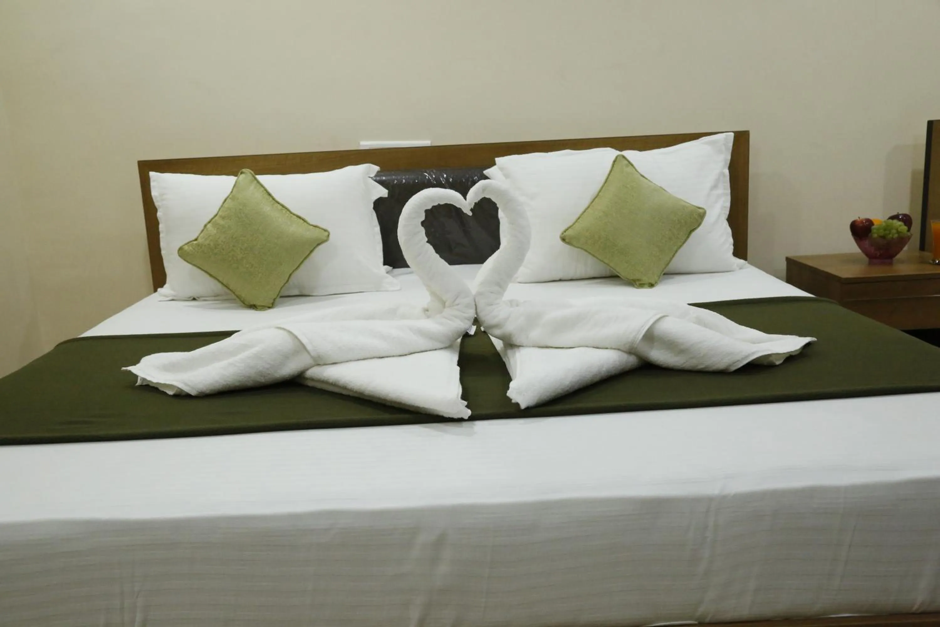 Bedroom in Hotel New Amirtham inn