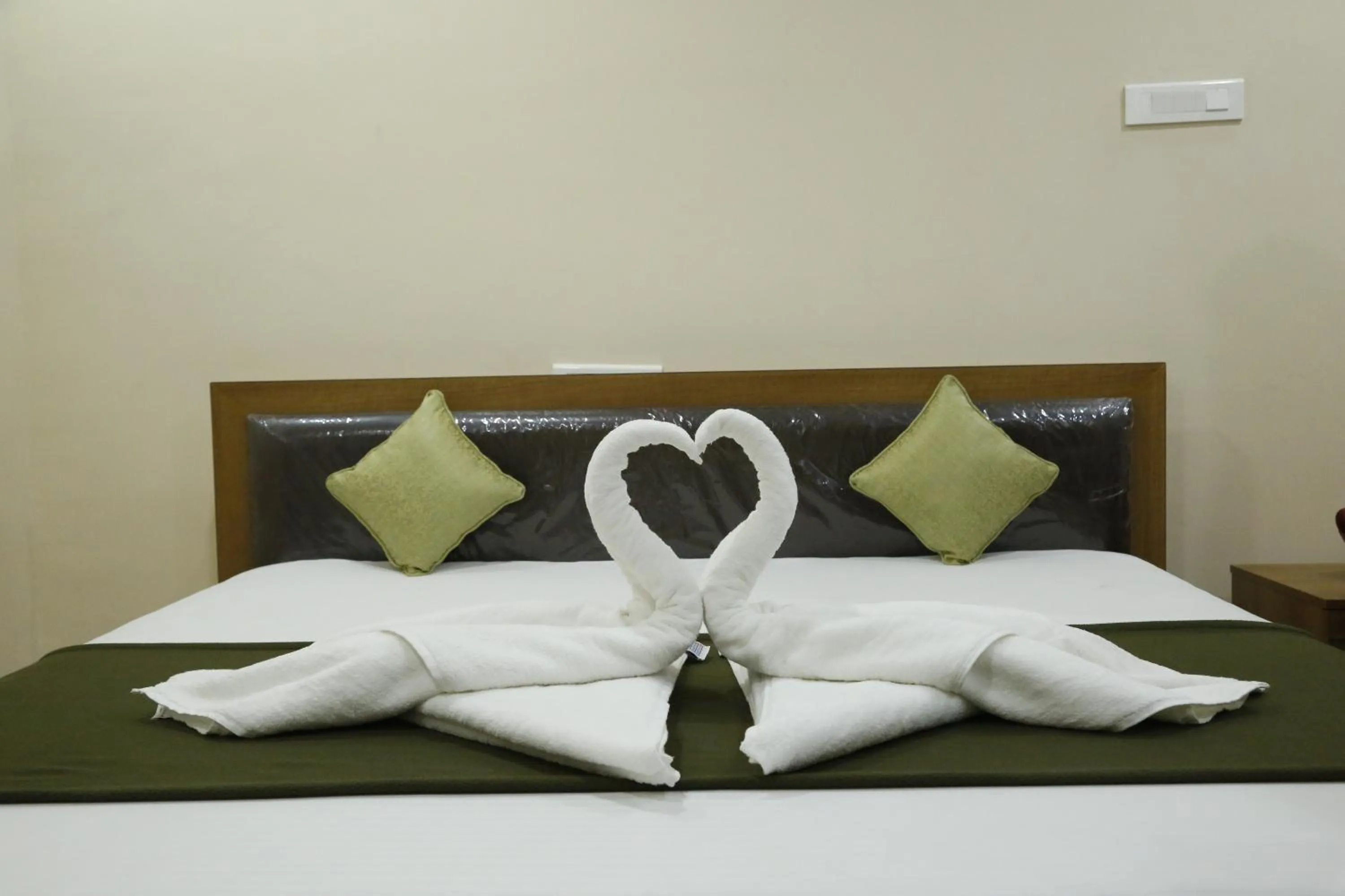 Bedroom in Hotel New Amirtham inn