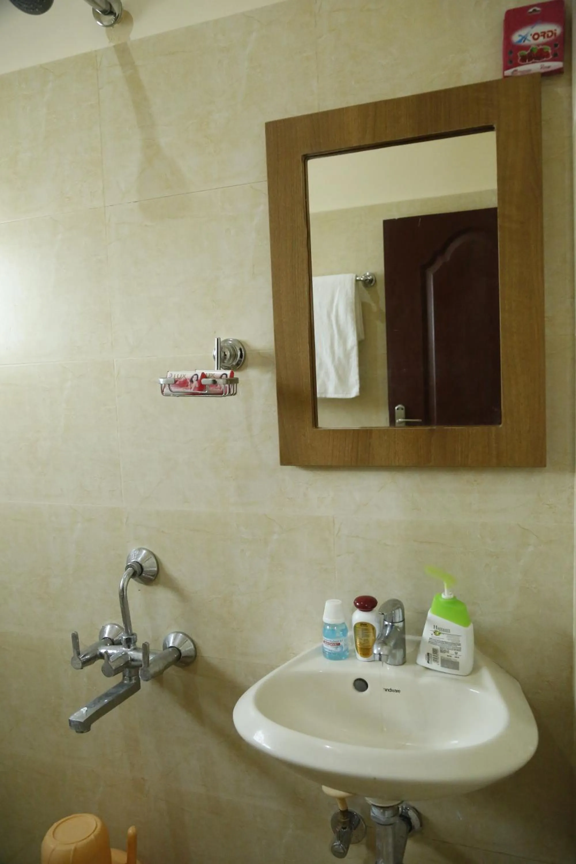 Bathroom in Hotel New Amirtham inn