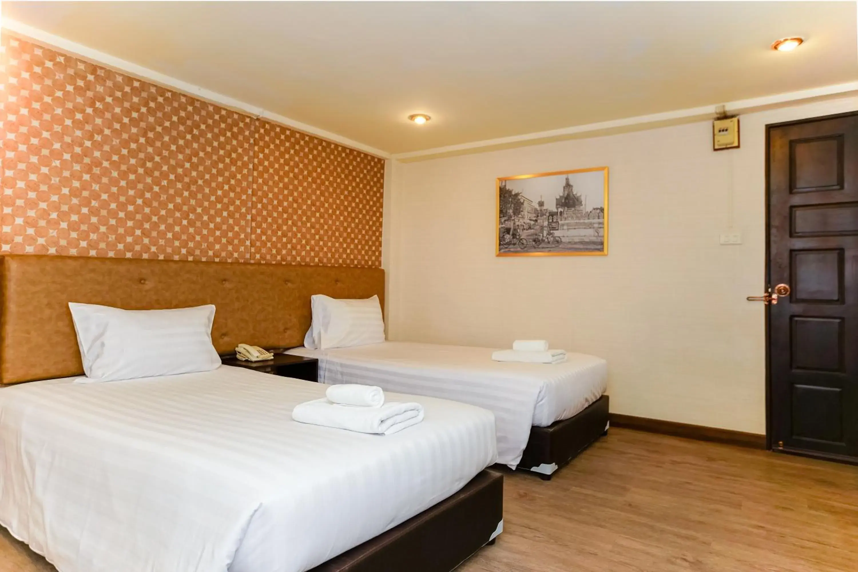 Bed in Parasol Inn Chiang Mai Old City Bed in Parasol Inn Chiang Mai Old City