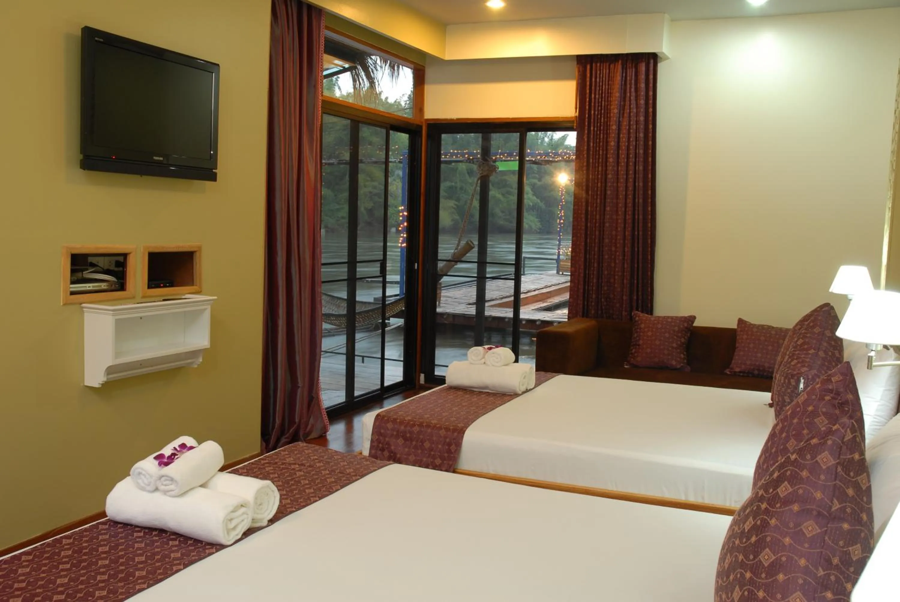 Bed in Boutique Raft Resort, River Kwai