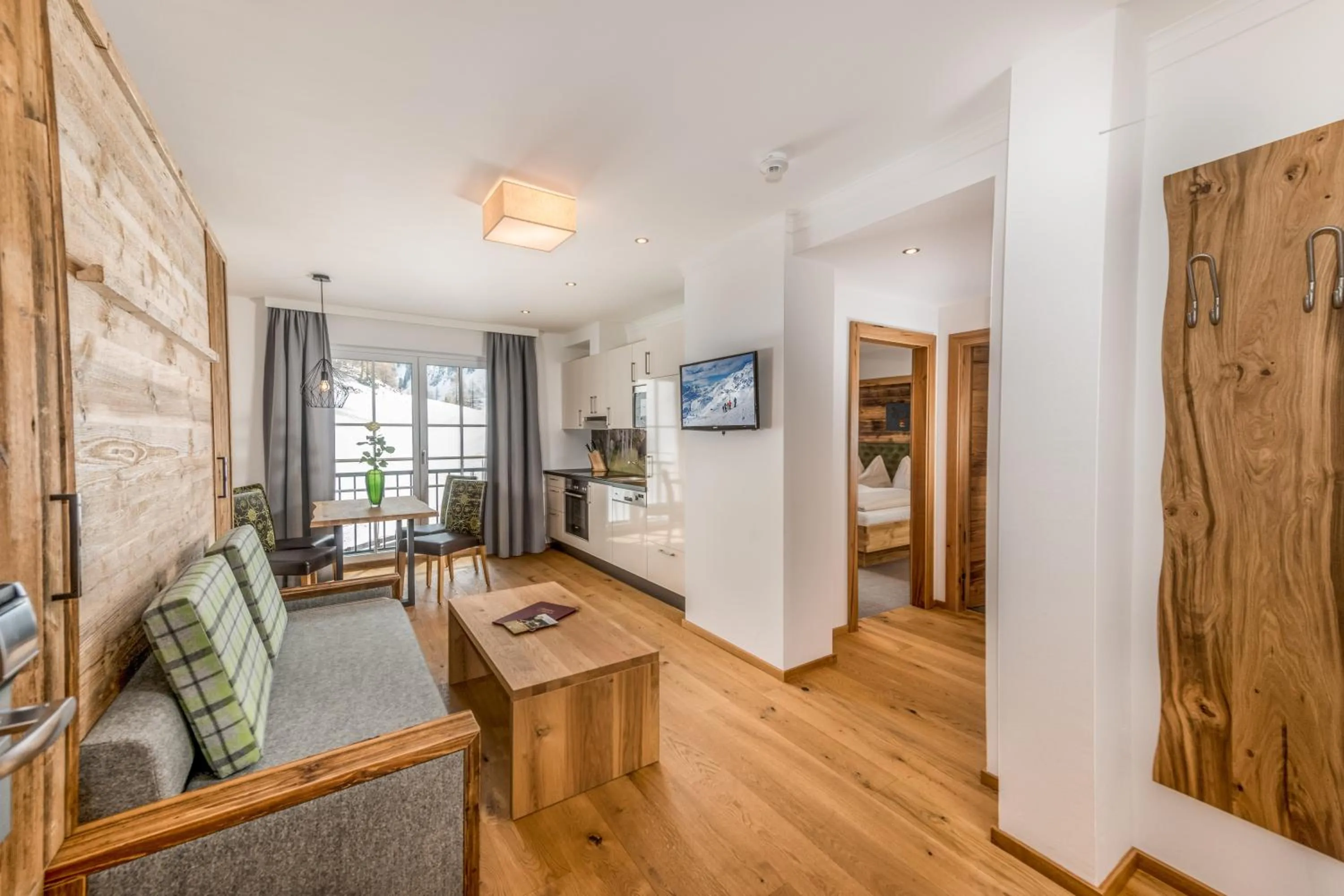 Communal lounge/ TV room in Hotel Almschlössl & Schrotteralm