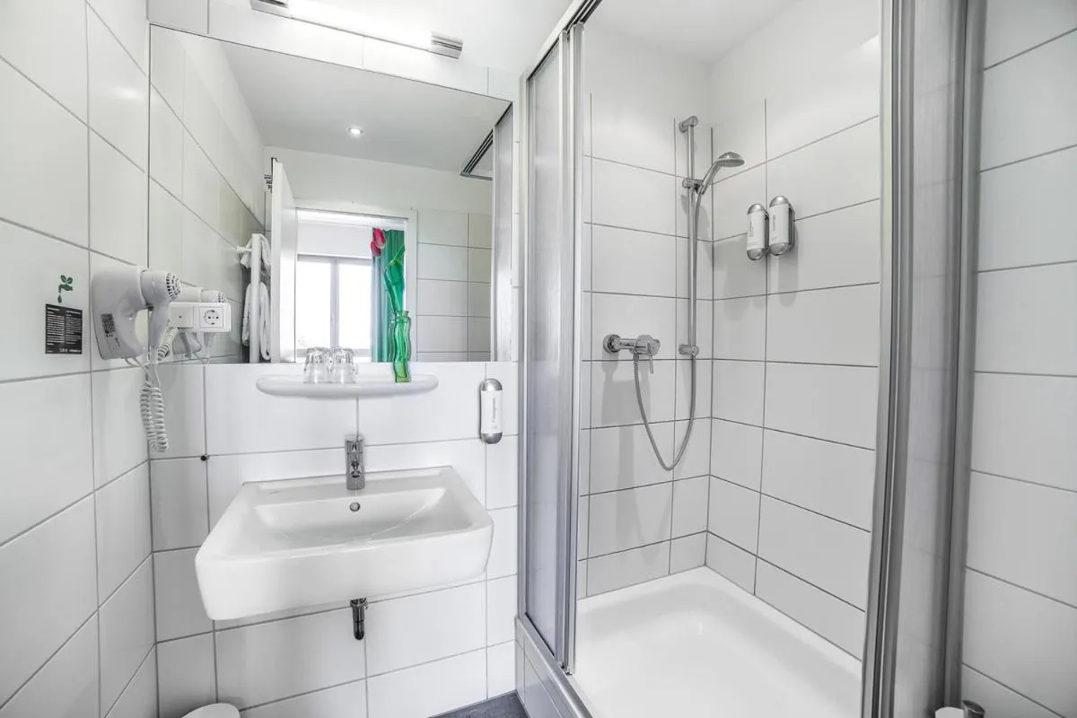 Bathroom in H+ Hotel 4Youth