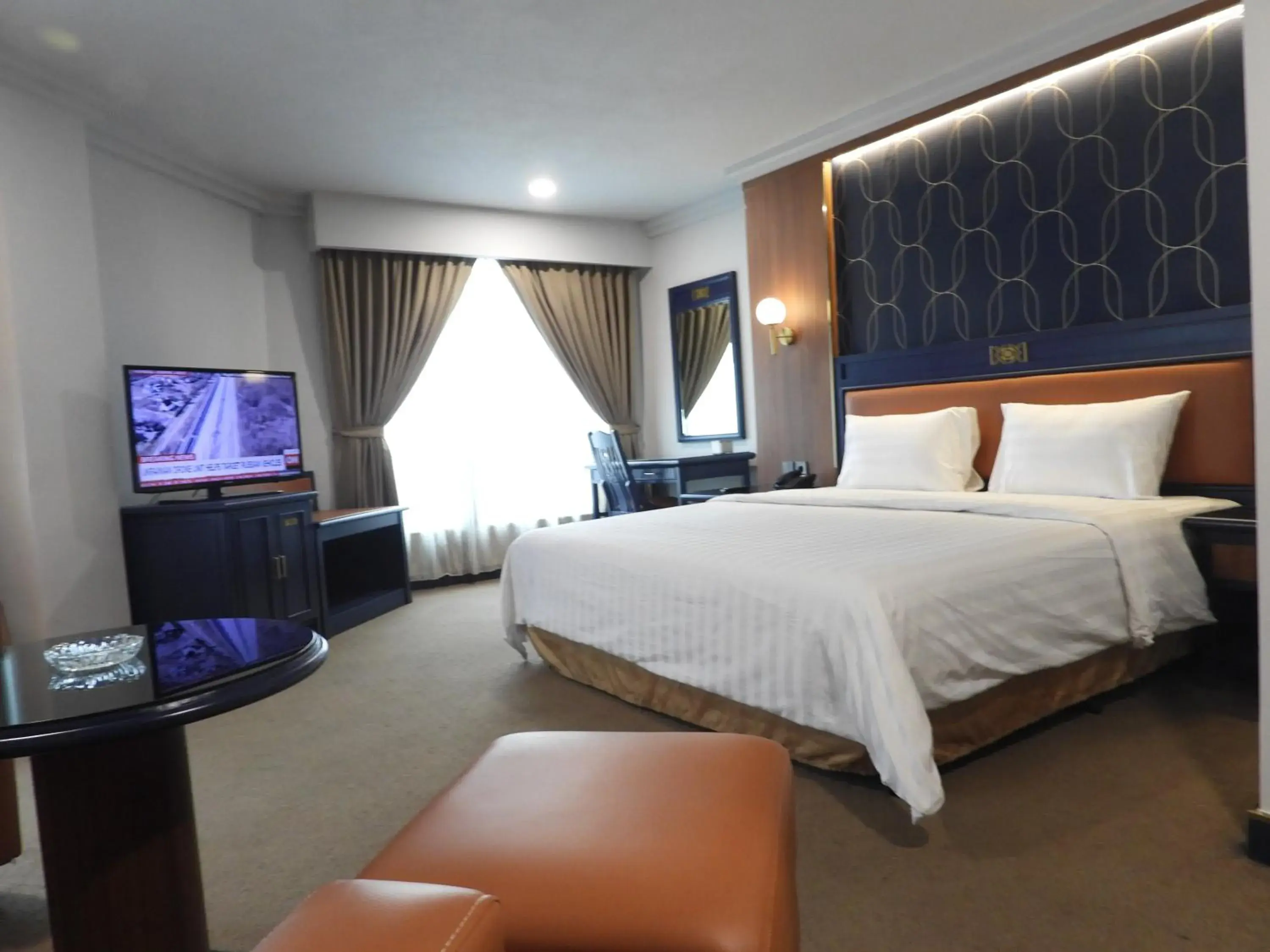 Bed in Travellers Hotel Jakarta
