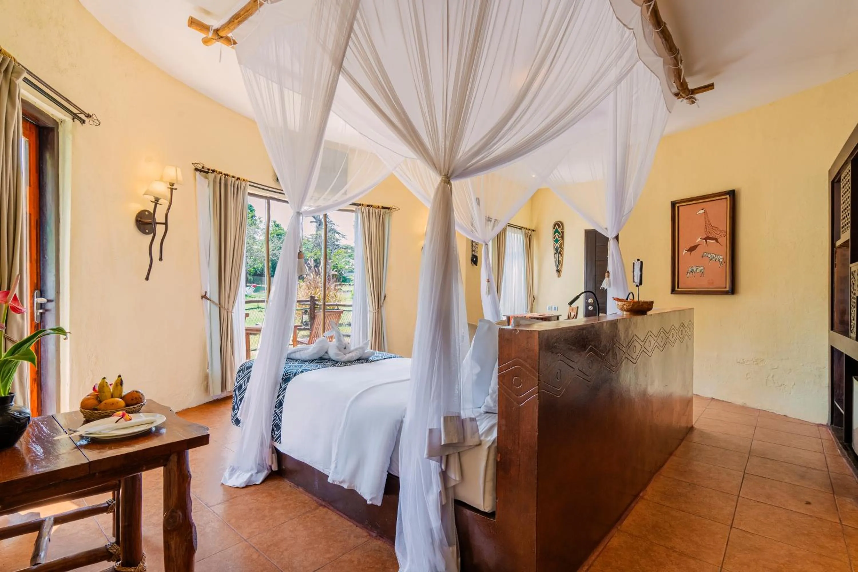 Photo of the whole room, Bed in Mara River Safari Lodge Bali