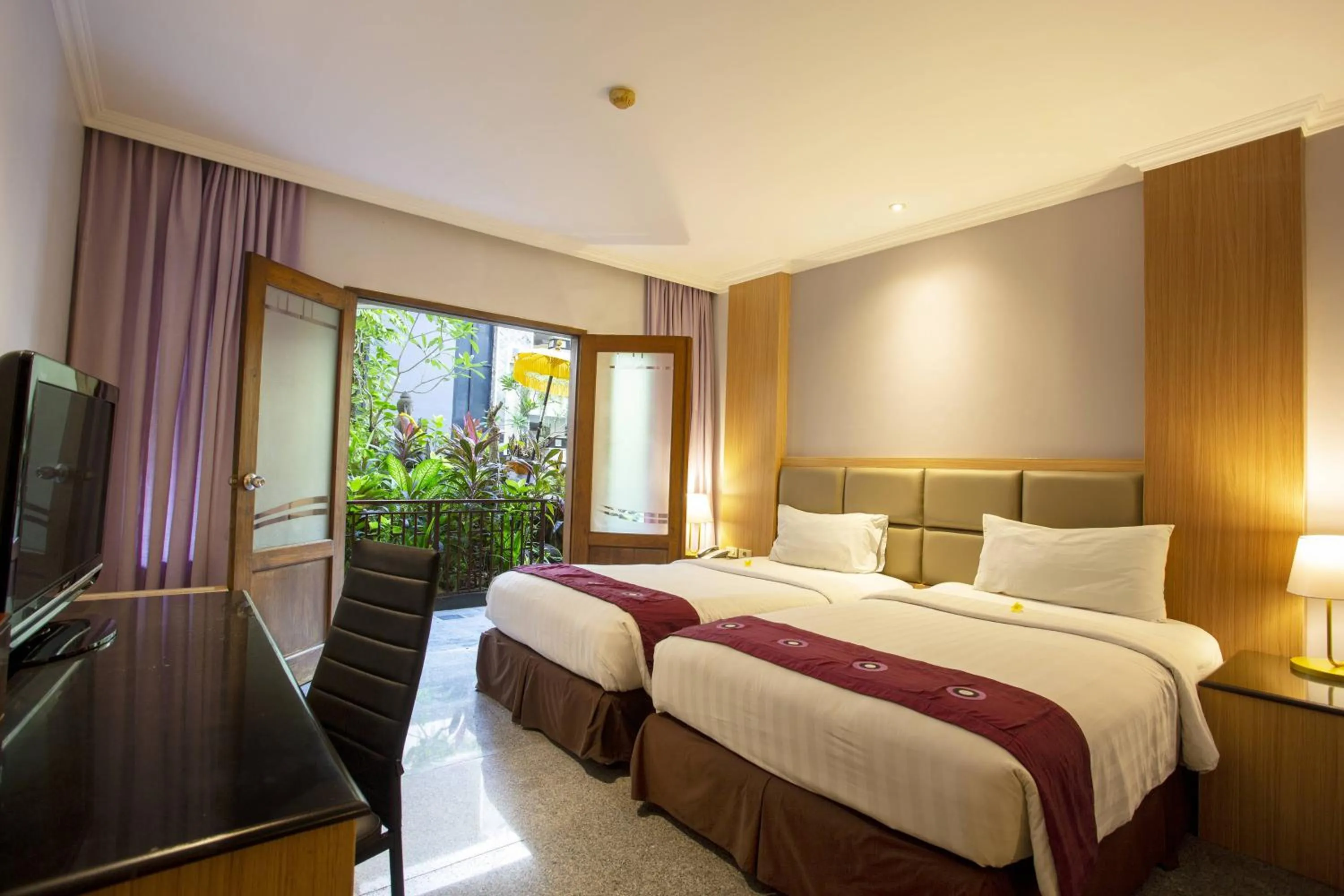 Bed in Famous Hotel Kuta Formerly Permata Kuta Hotel