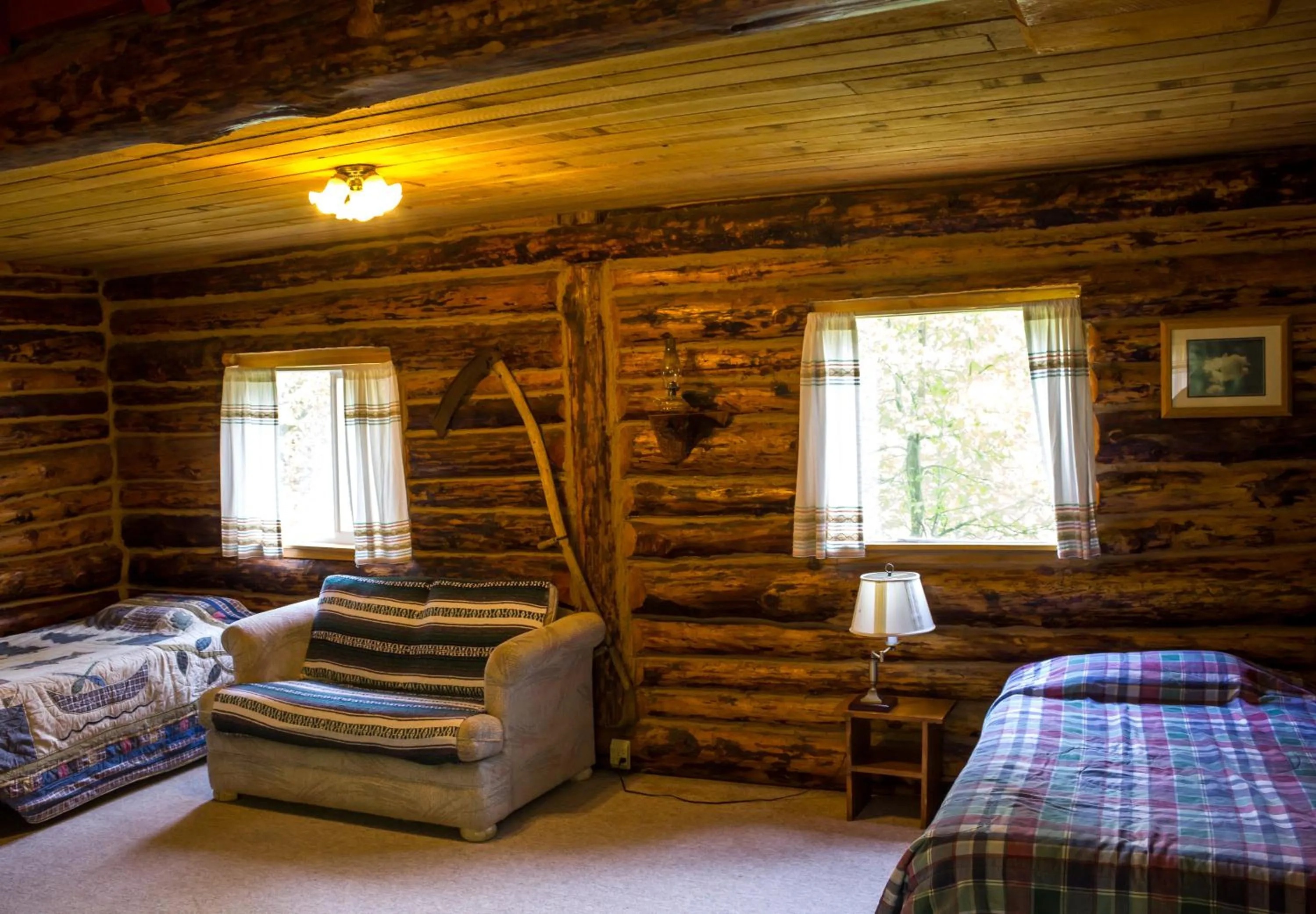 Bed in Midnight Sun Log Cabins