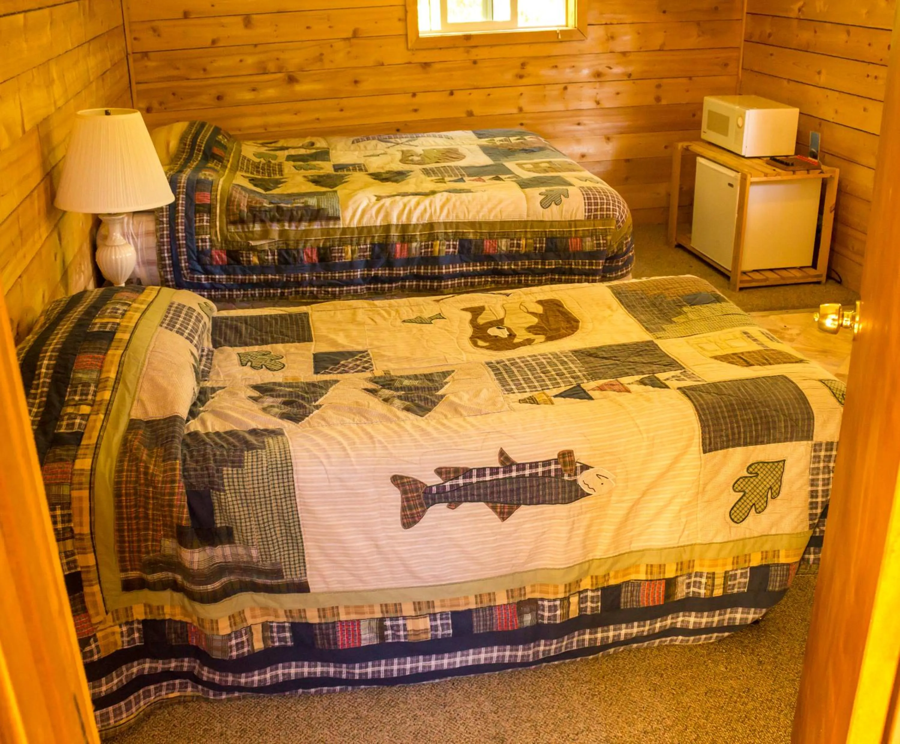 Bed in Midnight Sun Log Cabins