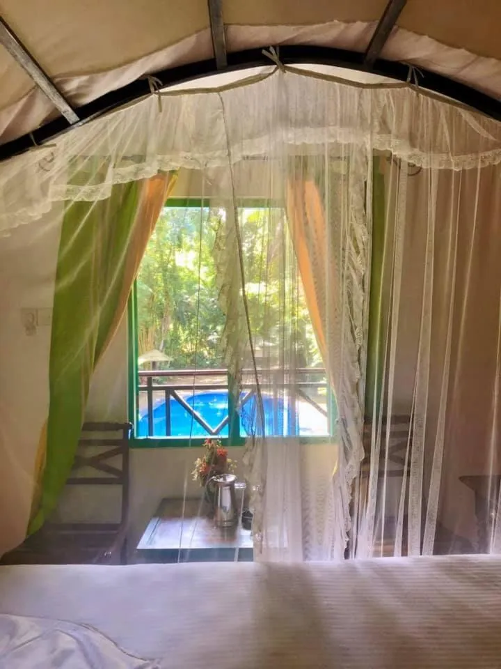 Bed in Hareesha Holiday Resort