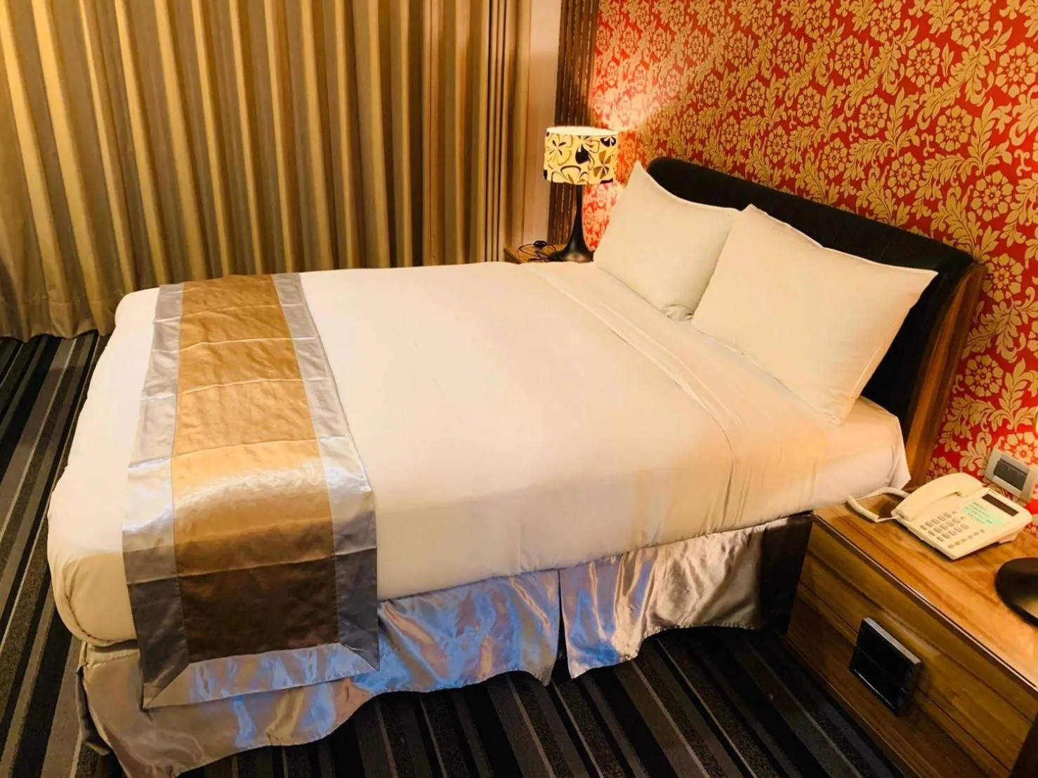 Bed in Kaishen Sinsu Hotel