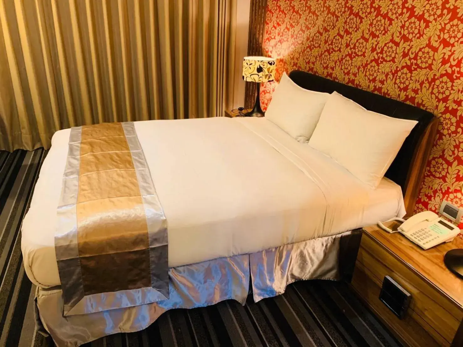 Bed in Kaishen Sinsu Hotel Bed in Kaishen Sinsu Hotel