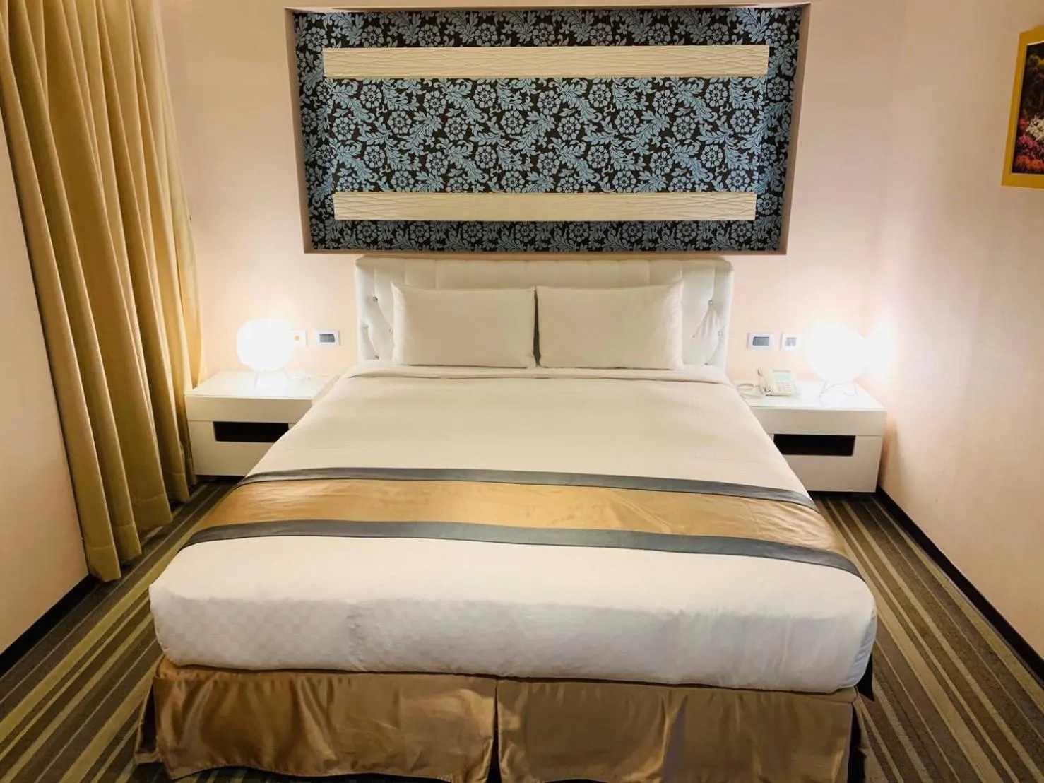 Bed in Kaishen Sinsu Hotel