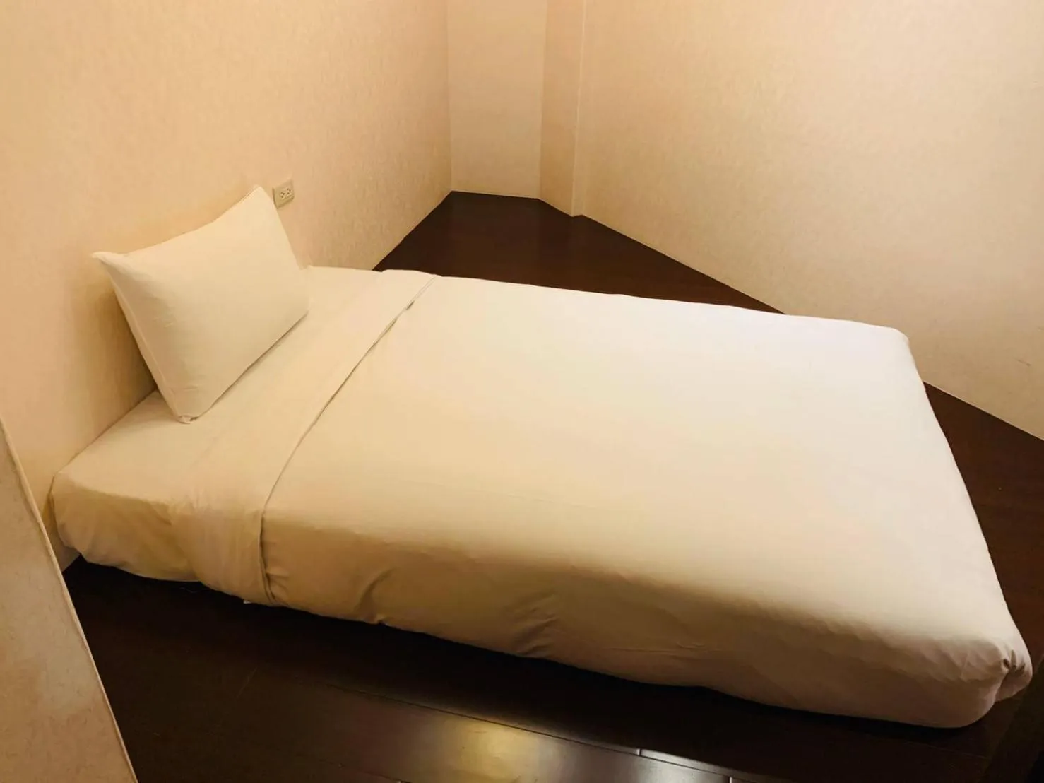 Bed in Kaishen Sinsu Hotel