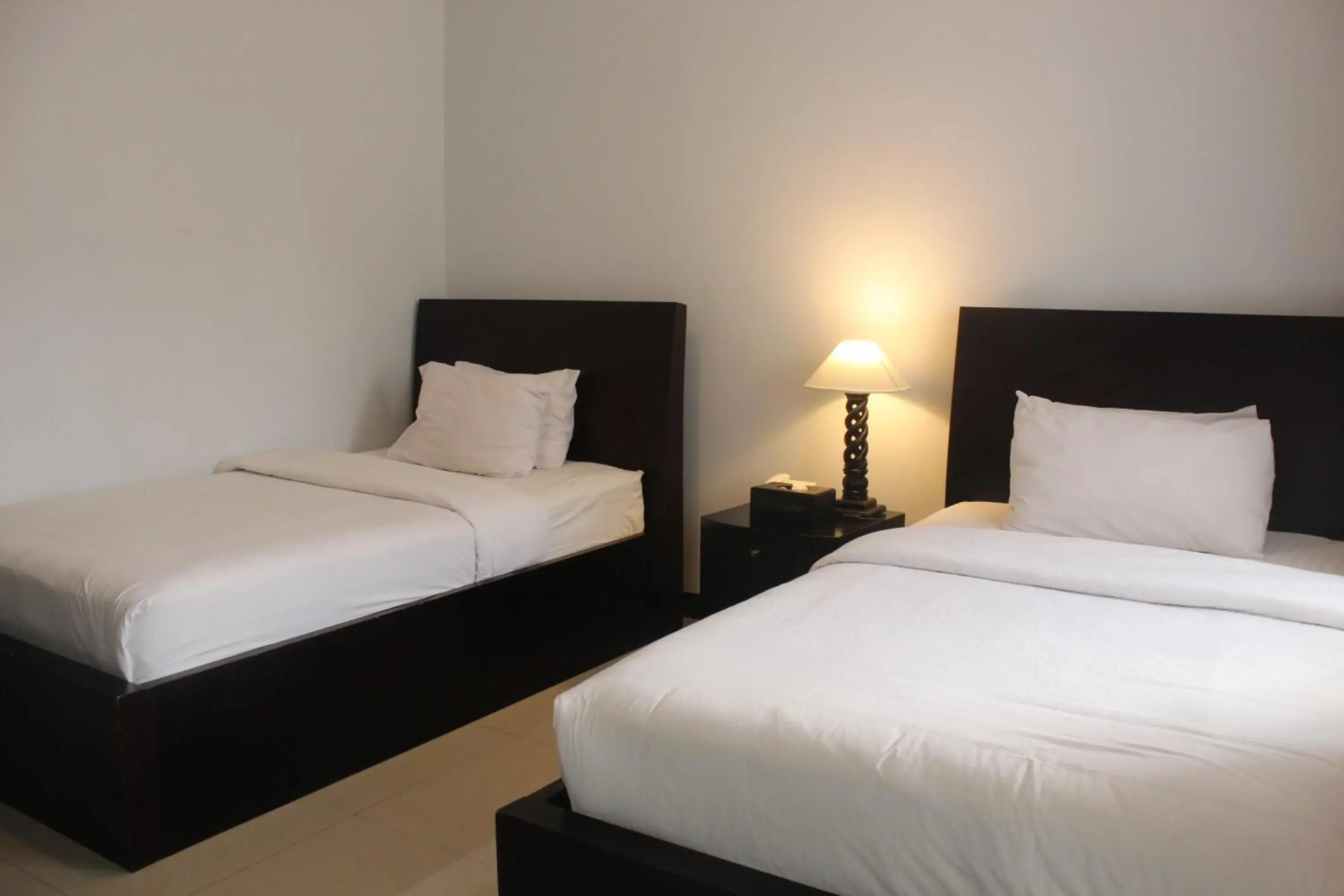 Bed in The Radiant Hotel Bed in The Radiant Hotel