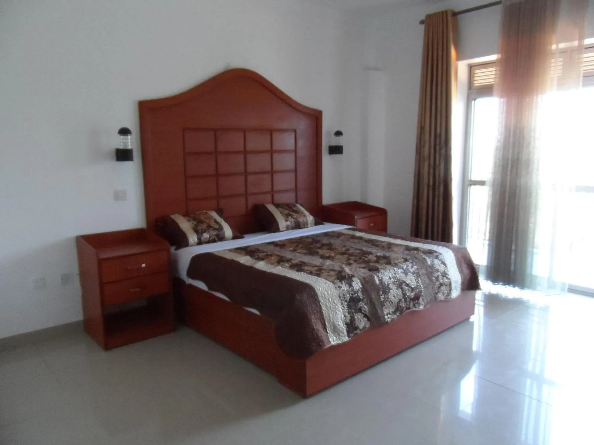 Bed in Zebra Hotel Masaka