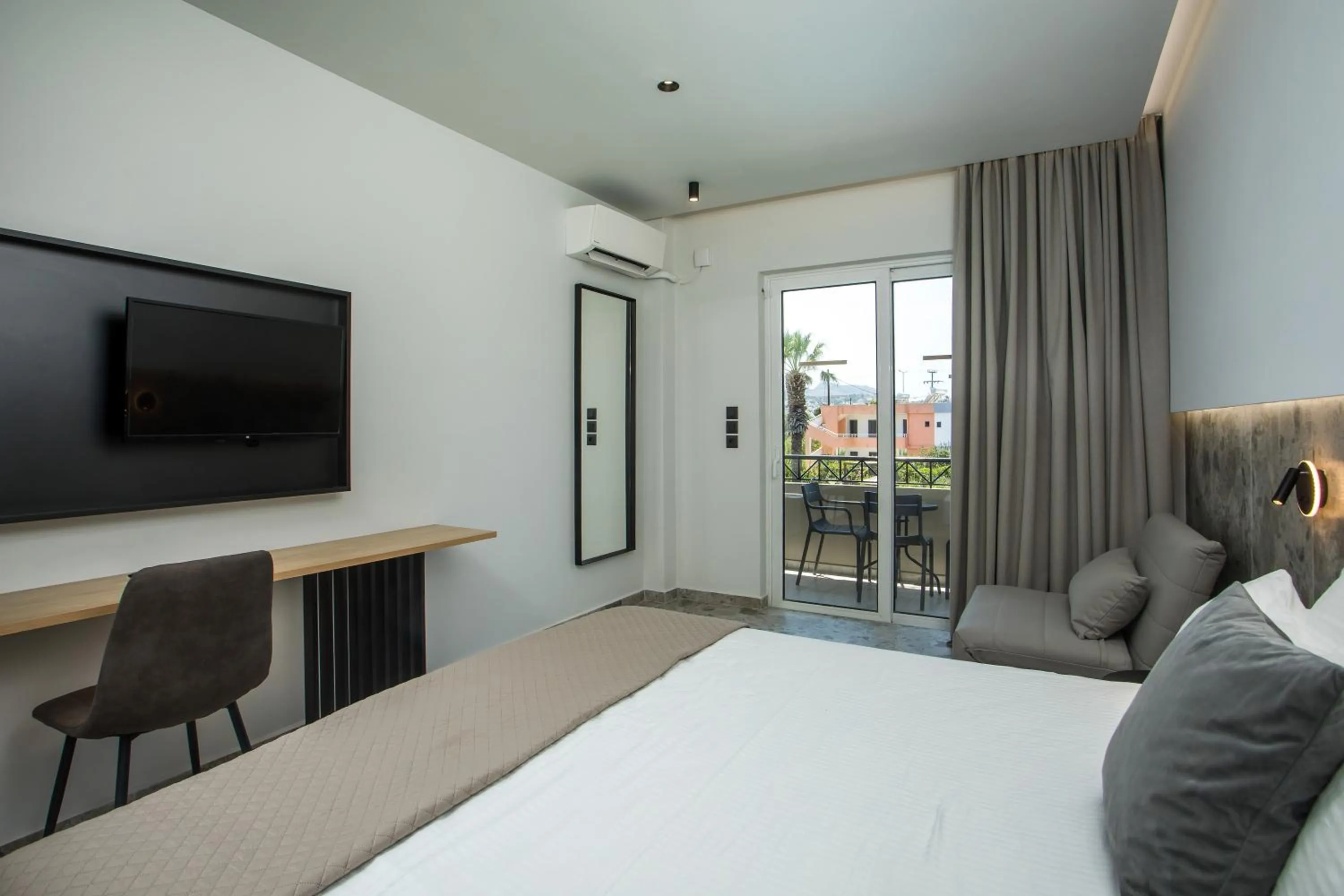 Bed in Dias Studios & Suites