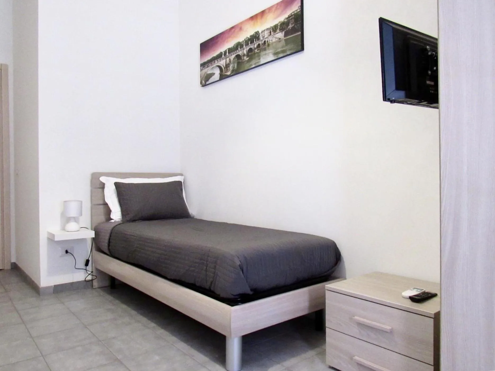 Bed in Roema Guest House