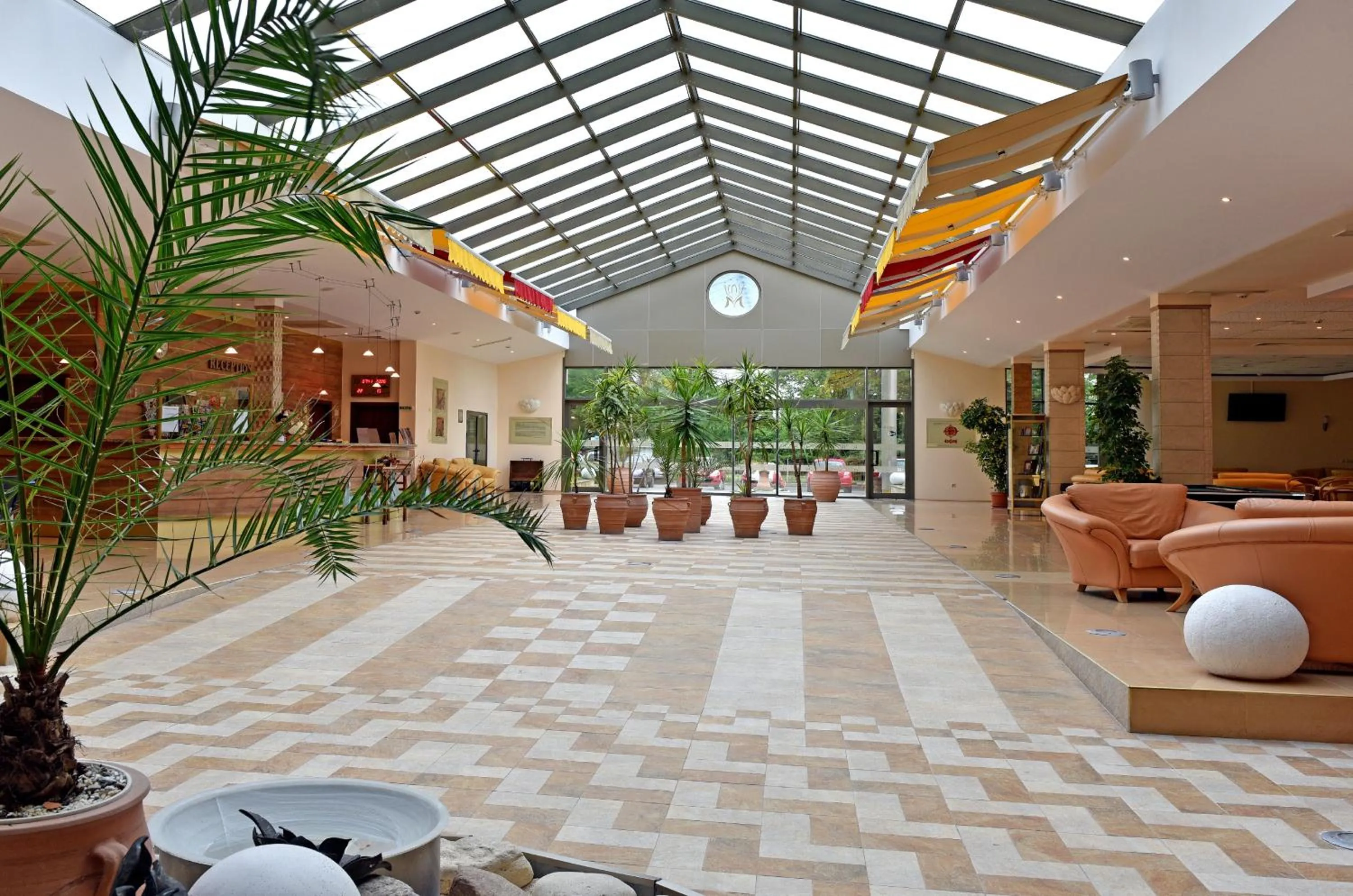Lobby or reception in Les Magnolias Hotel