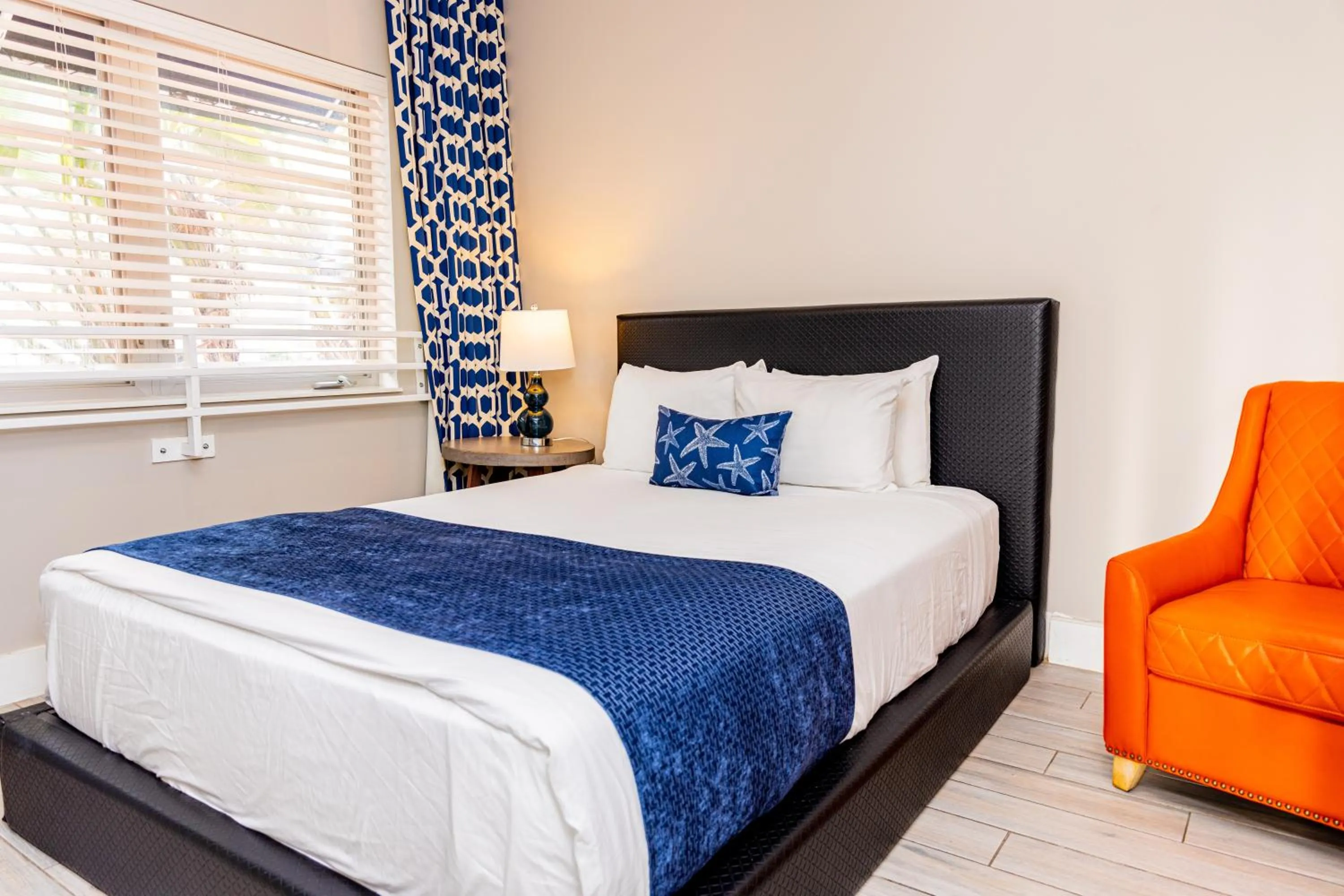 Bed in Oceanside Hotel and Suites