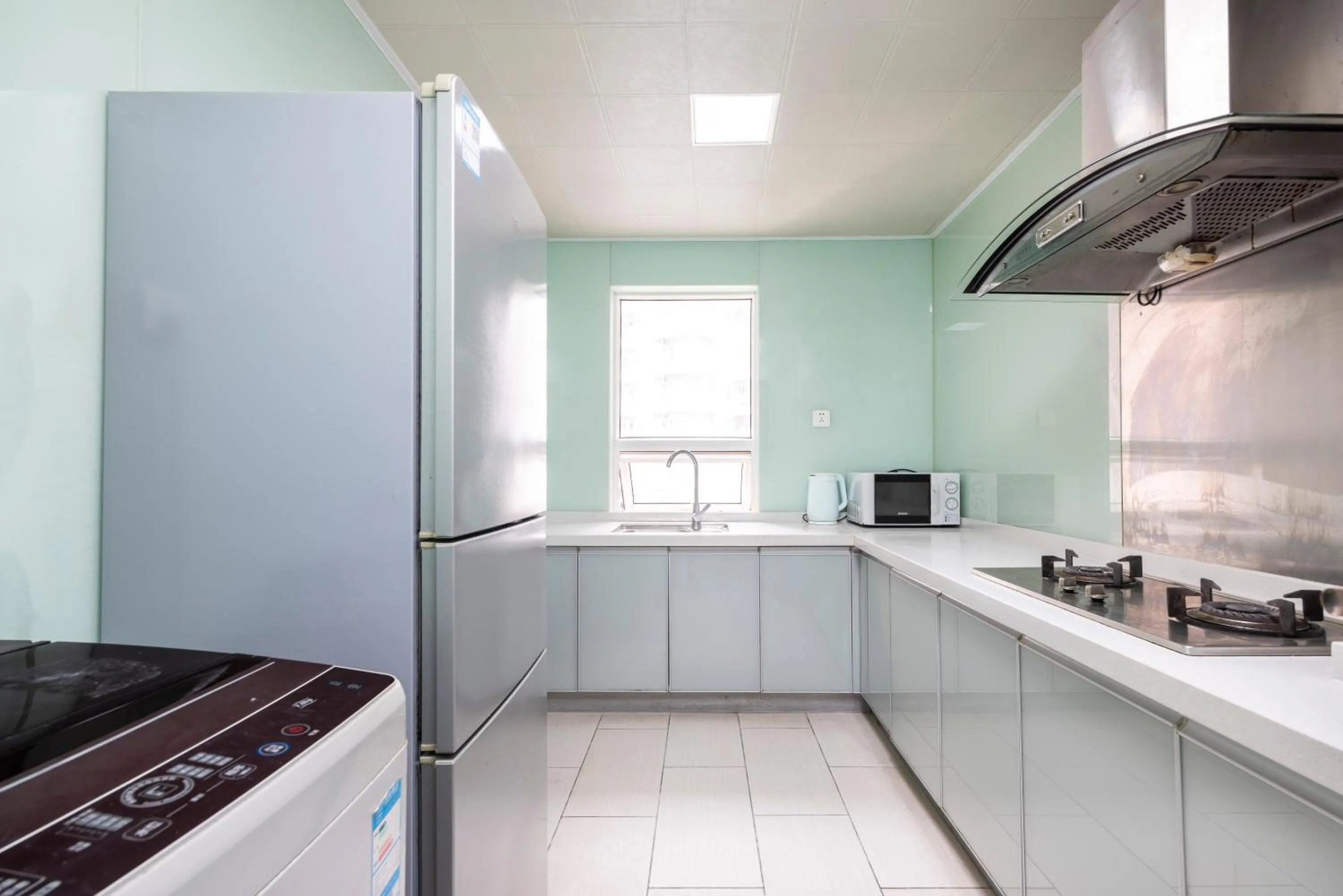 Kitchen or kitchenette in Sanya Sun Seaview Apartment