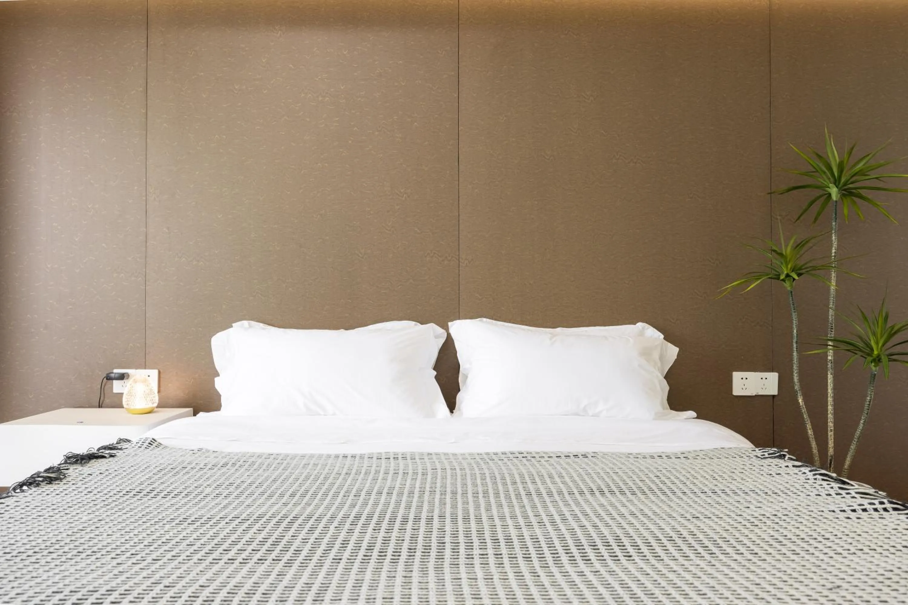 Bed in Sanya Sun Seaview Apartment