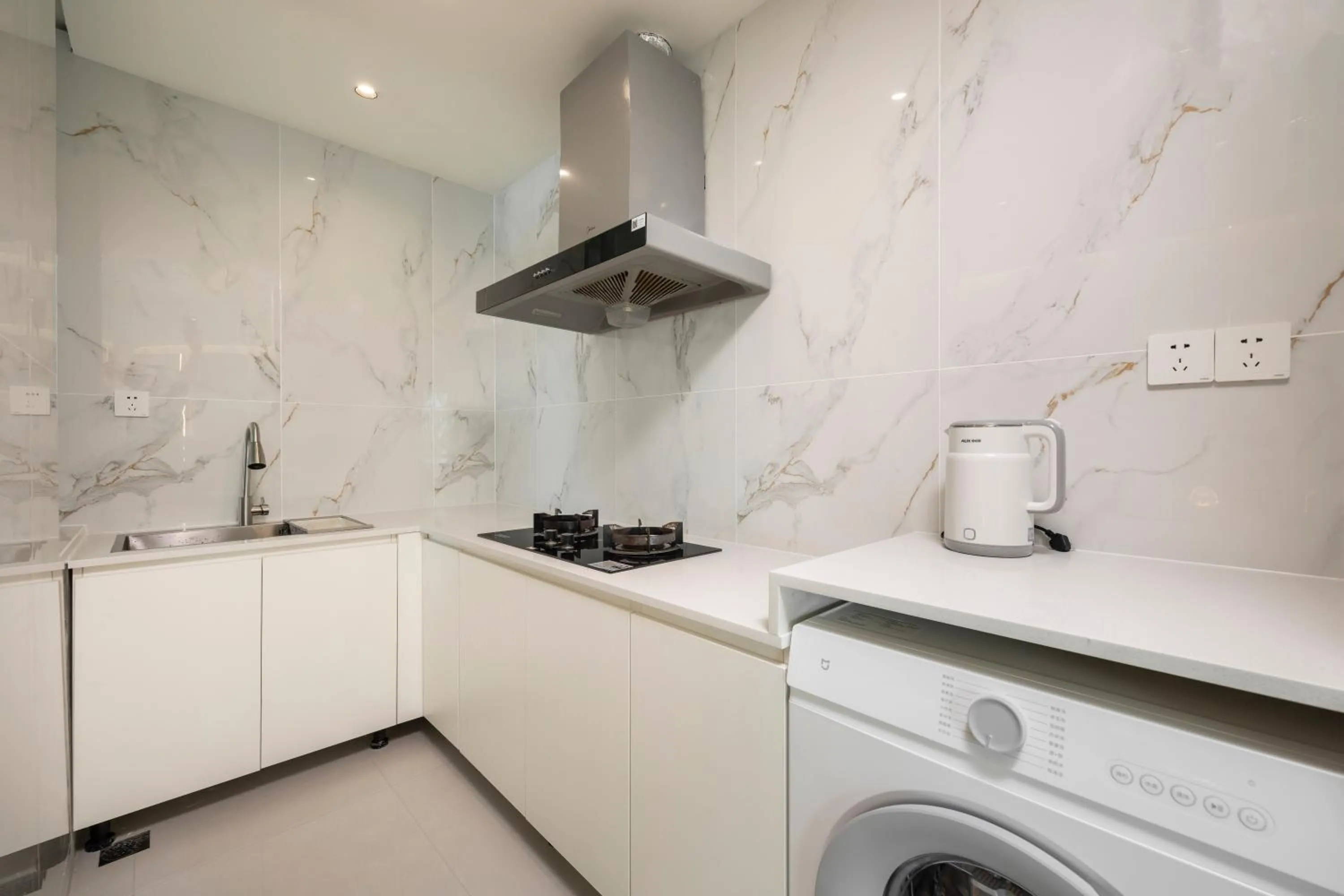 Kitchen or kitchenette in Sanya Sun Seaview Apartment