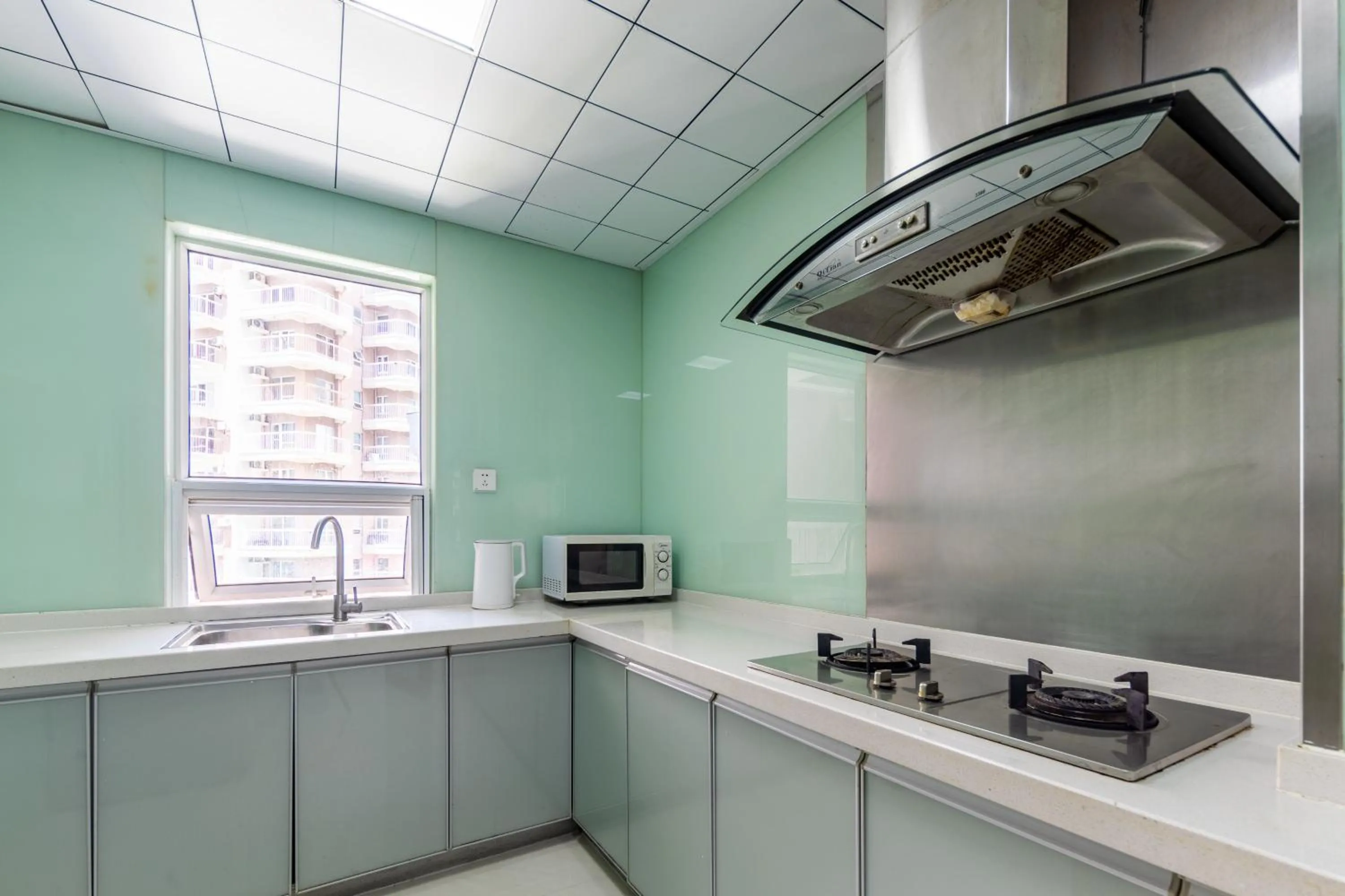 Kitchen or kitchenette in Sanya Sun Seaview Apartment