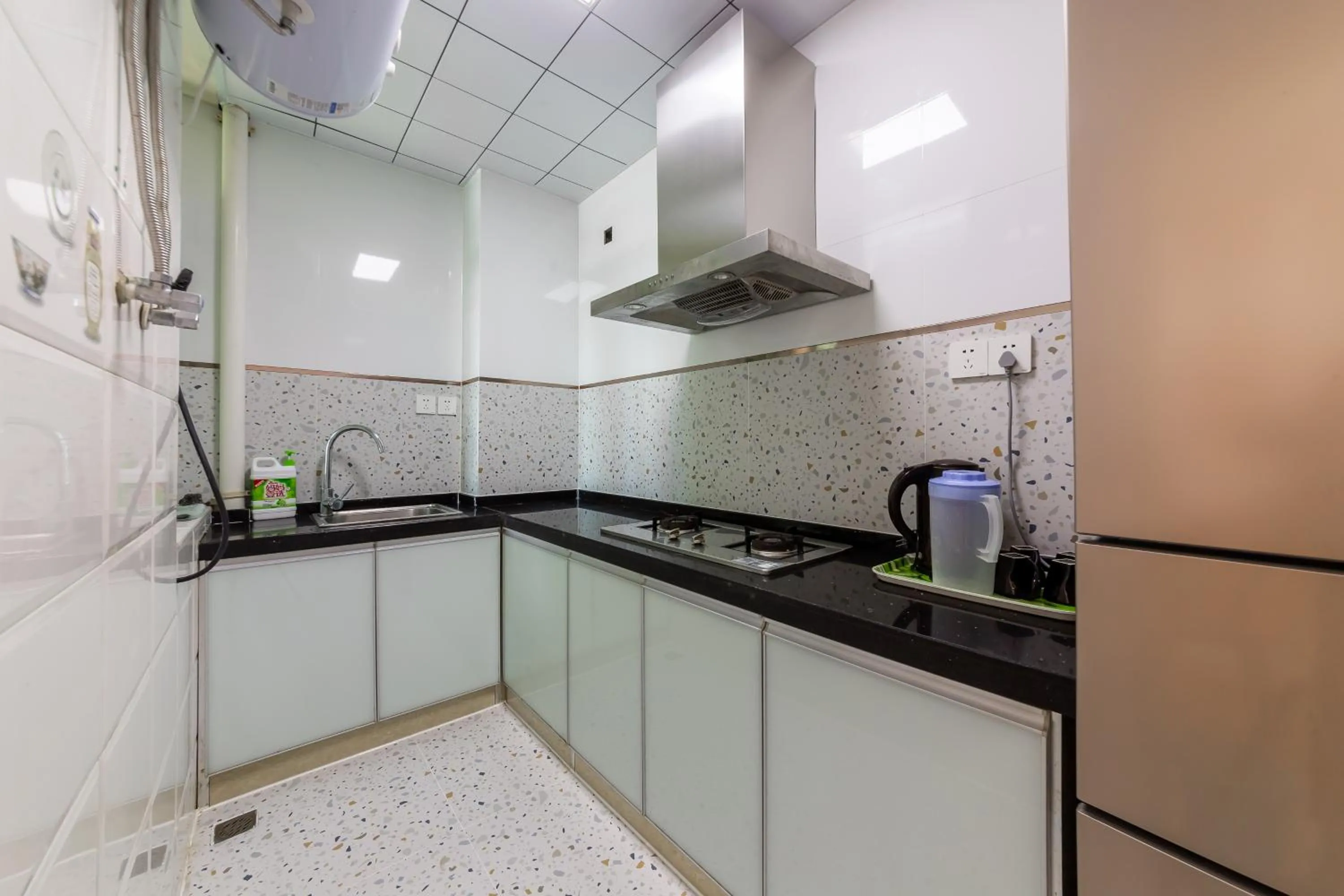 Kitchen or kitchenette in Sanya Sun Seaview Apartment
