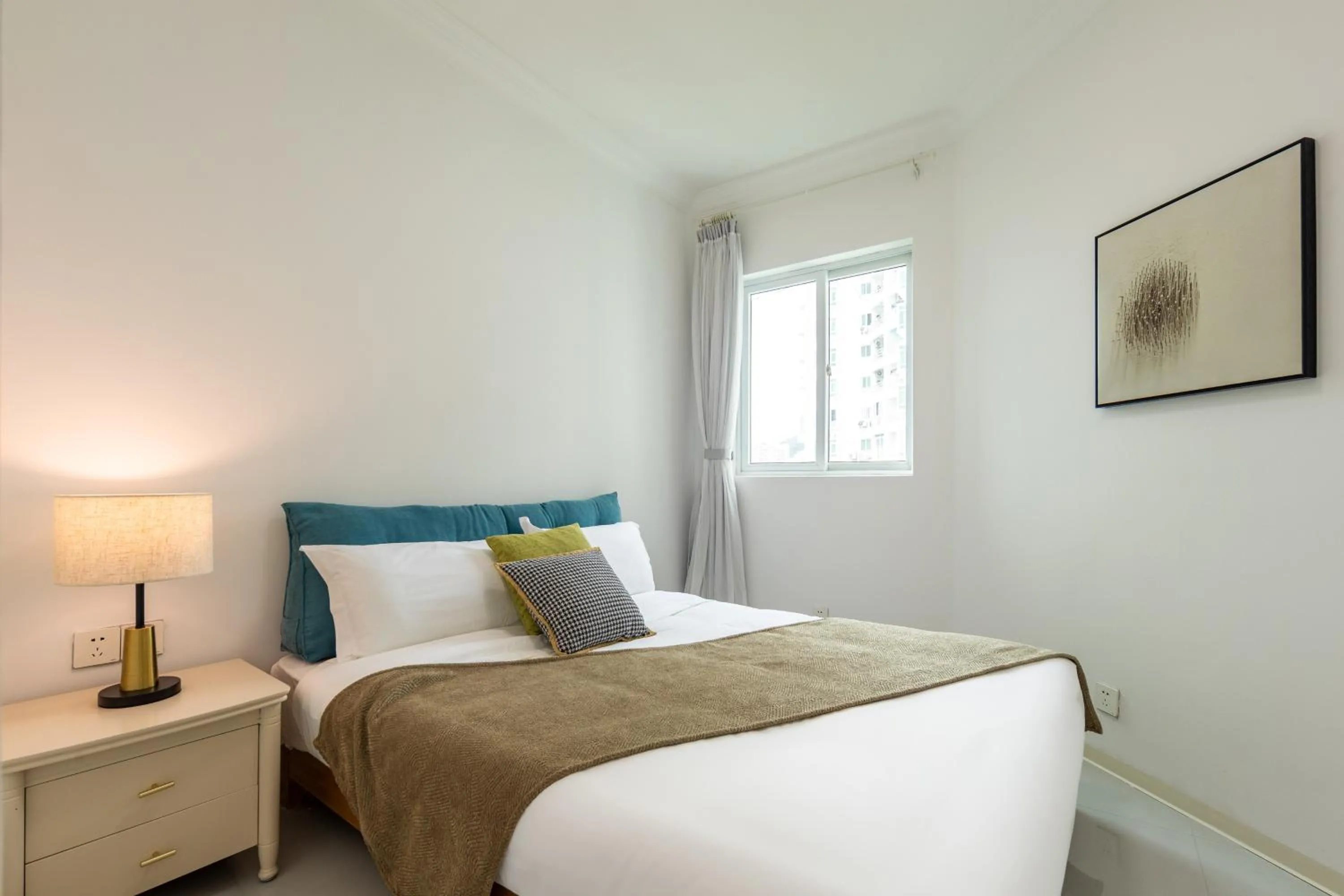 Bed in Sanya Sun Seaview Apartment