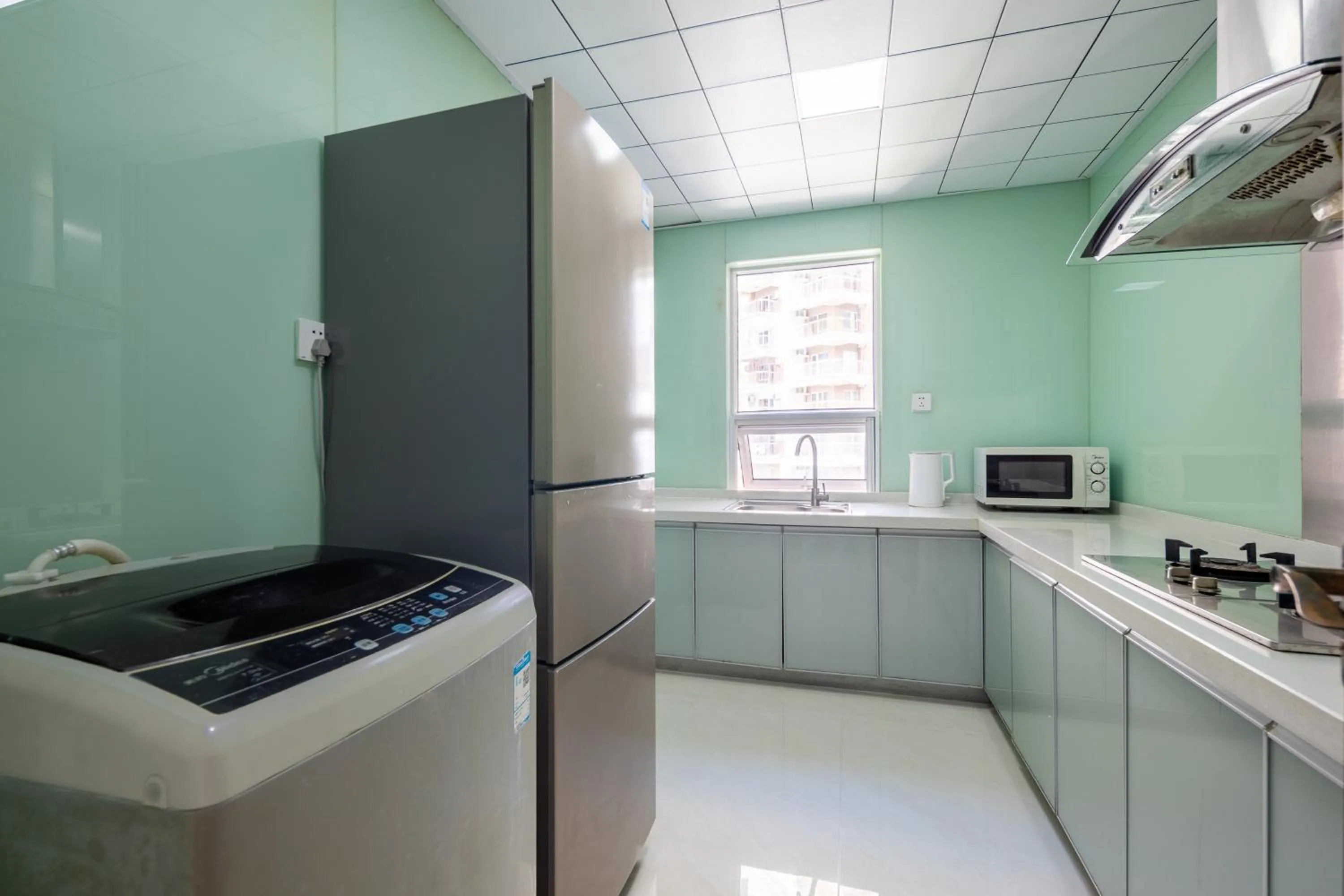 Kitchen or kitchenette in Sanya Sun Seaview Apartment