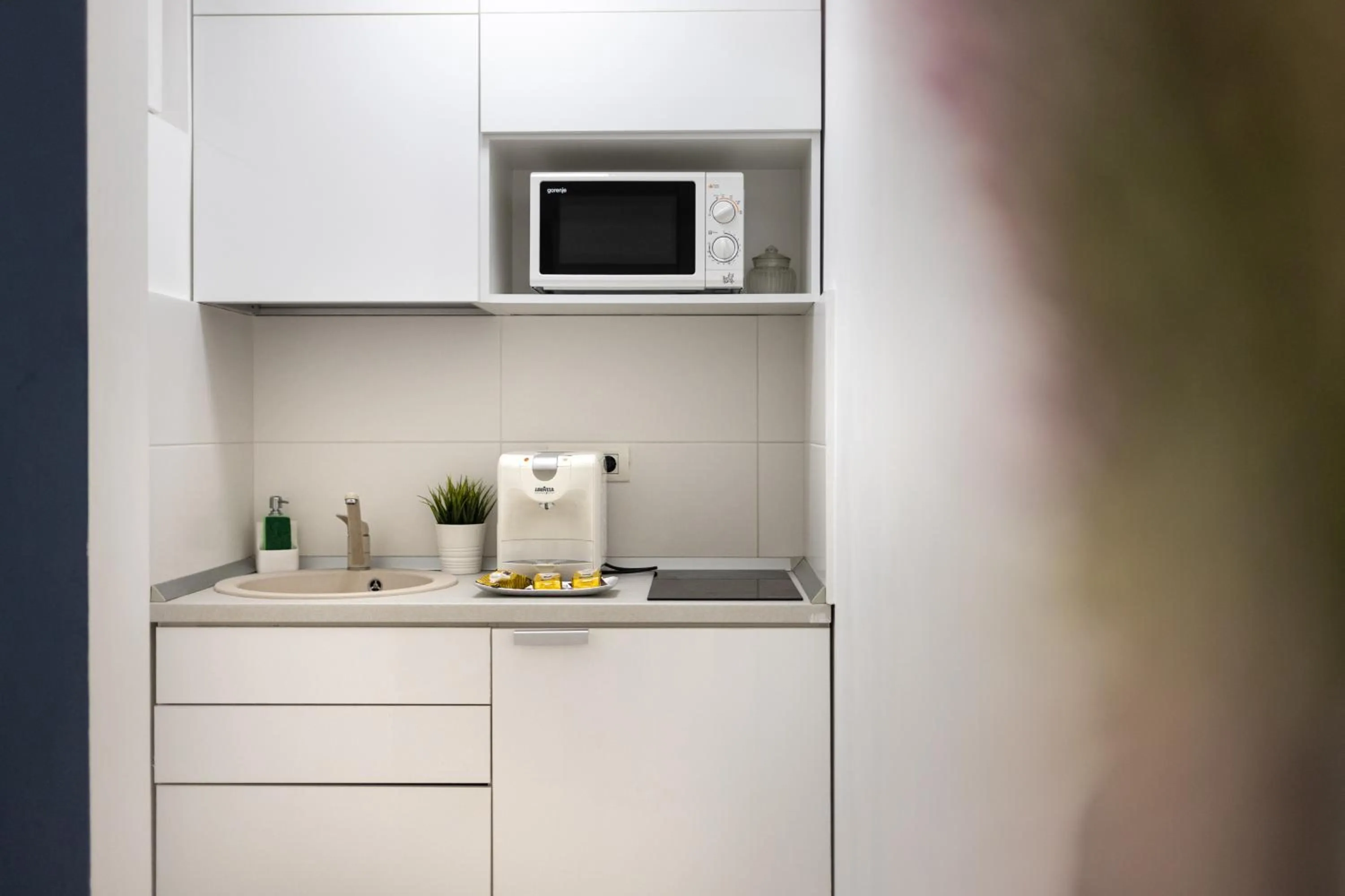 Kitchen or kitchenette in Metropole Apartments - Old City