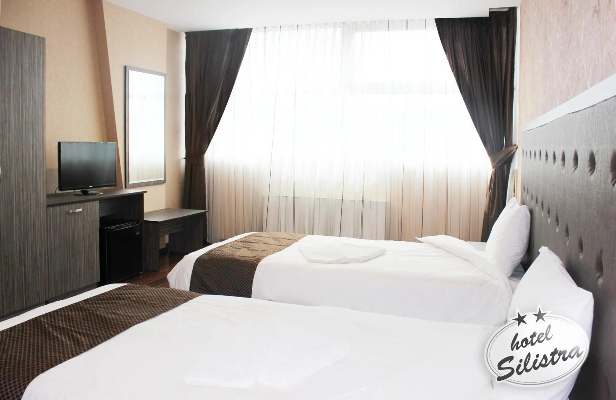 Text overlay, Bed in Family Hotel Silistra