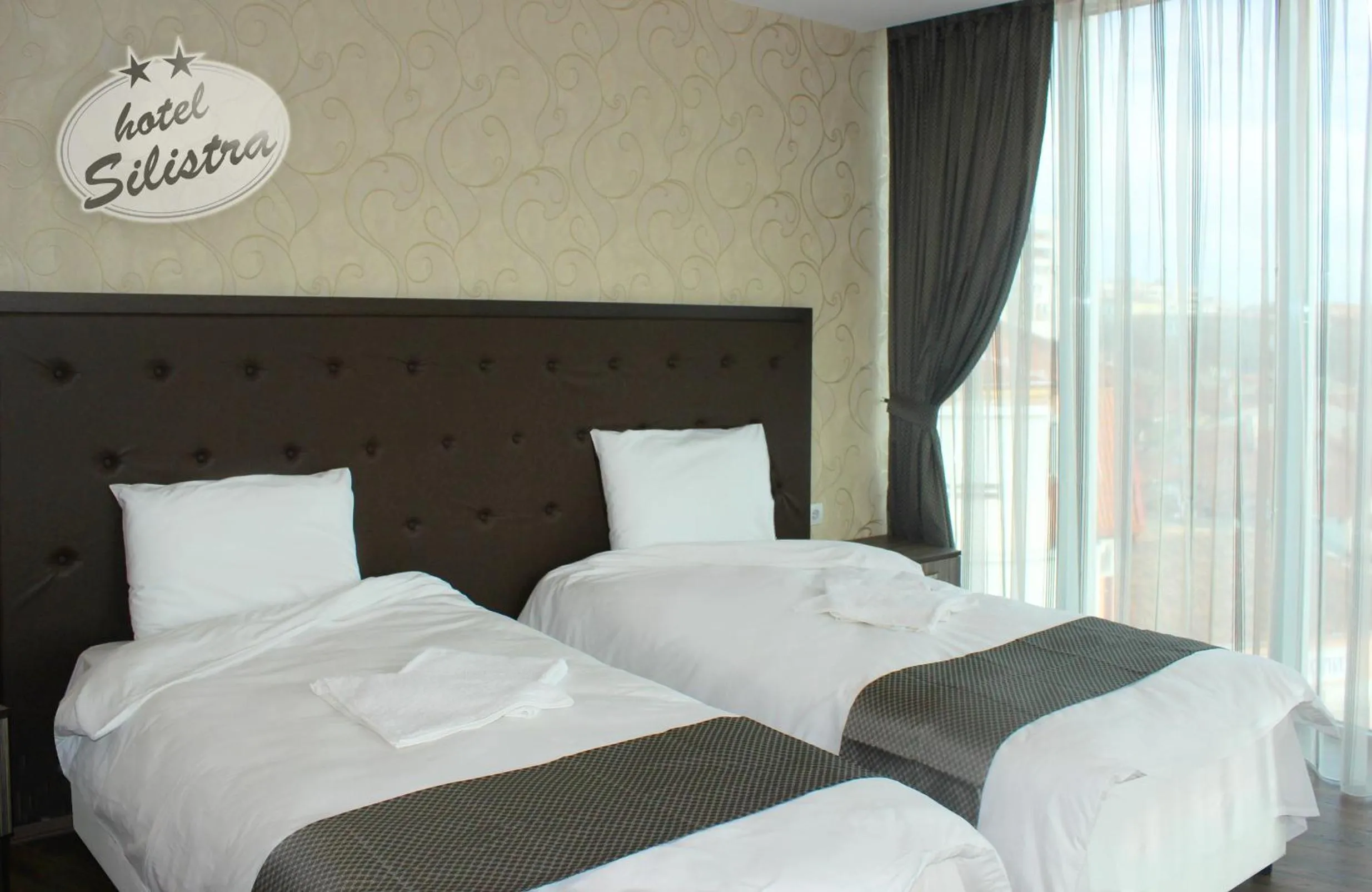 Text overlay, Bed in Family Hotel Silistra