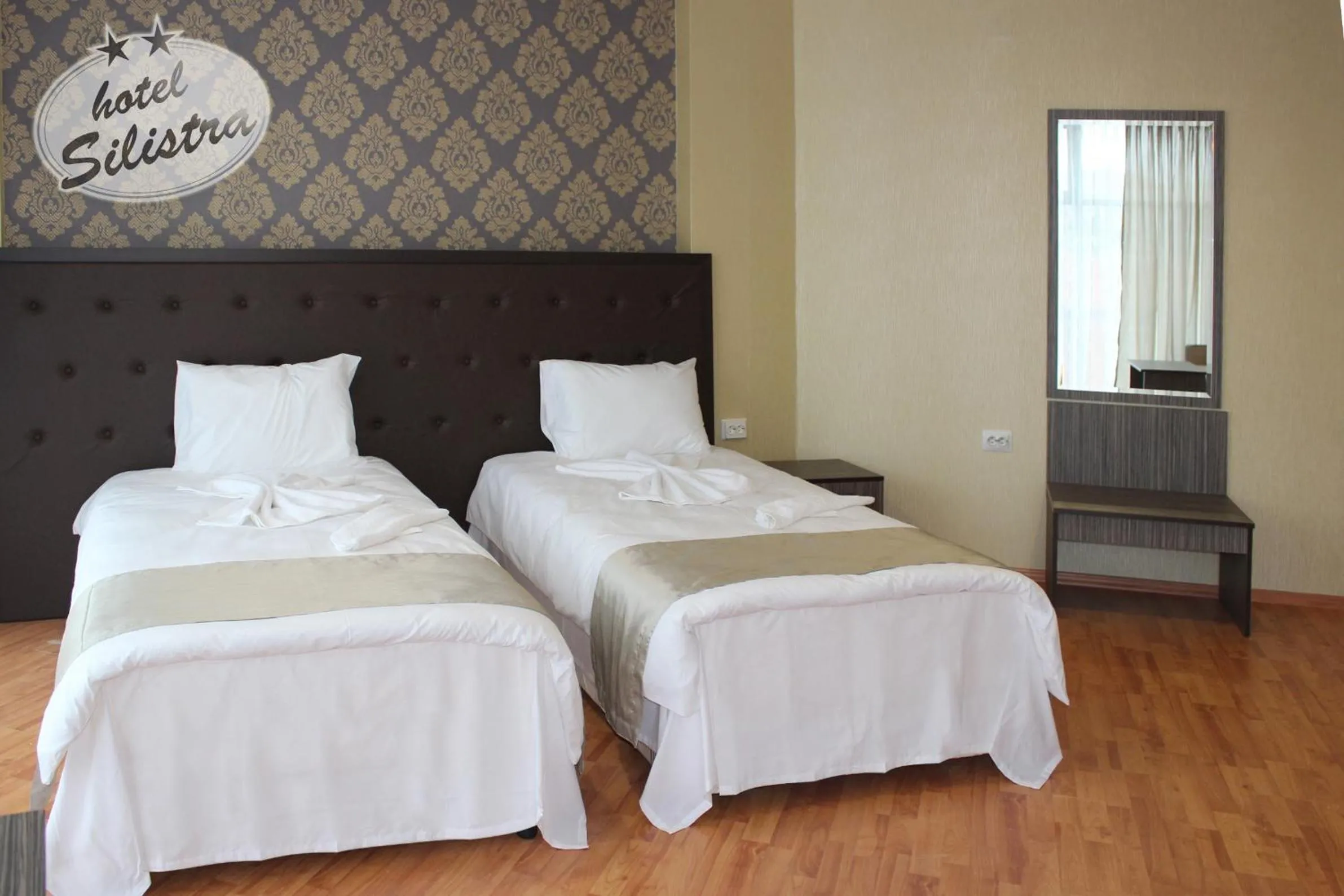 Text overlay, Bed in Family Hotel Silistra