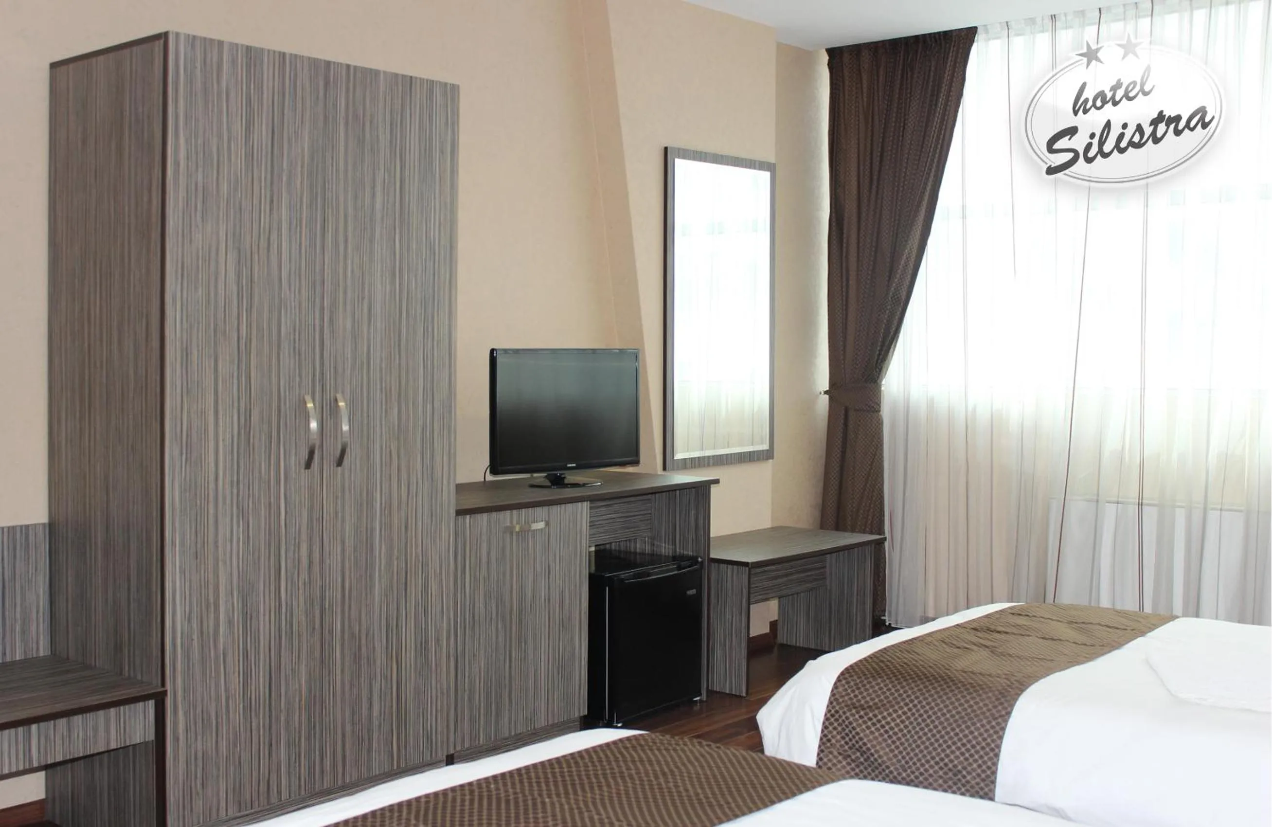Text overlay, Bed in Family Hotel Silistra