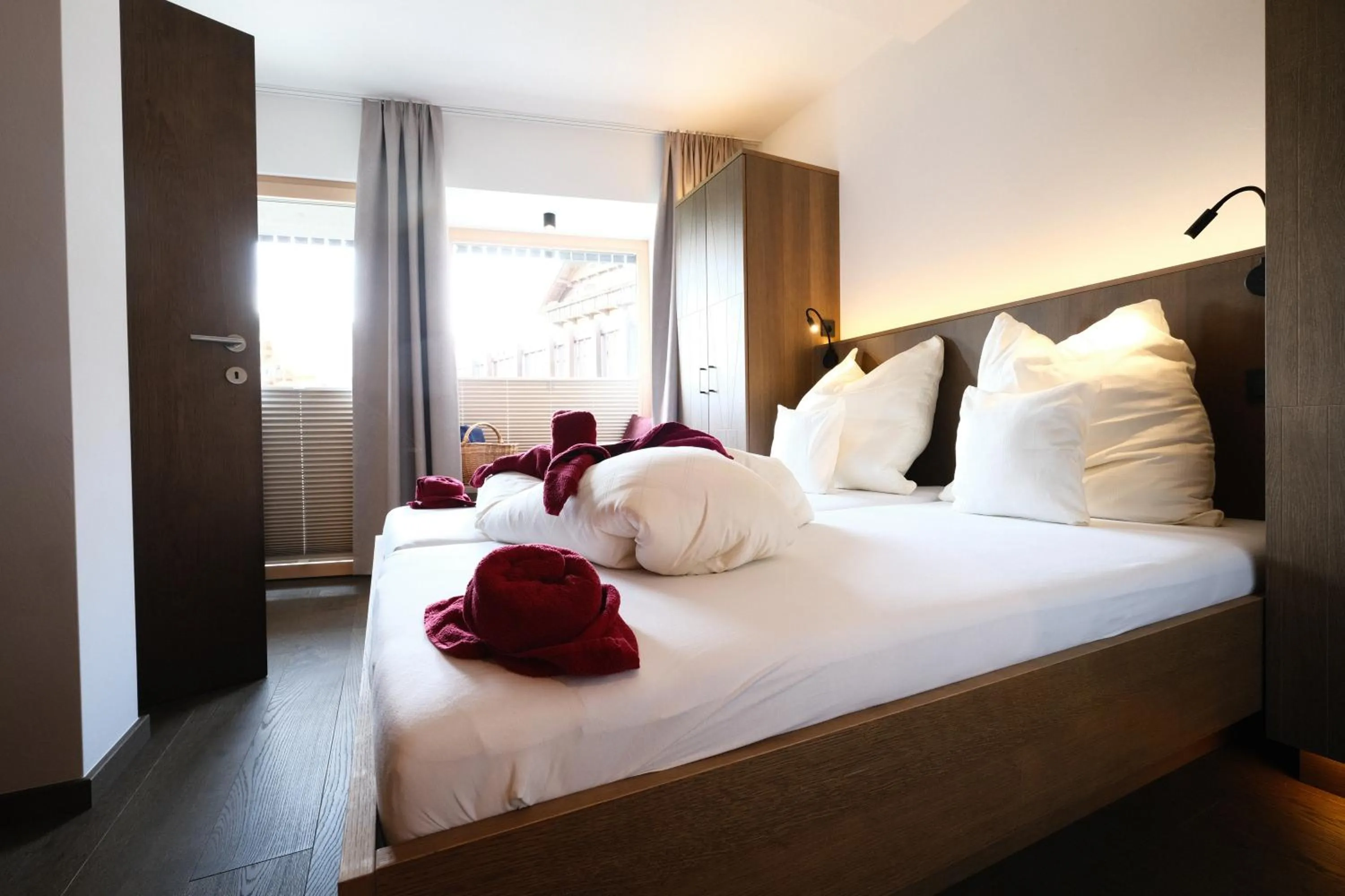 Bedroom, Bed in SeeHotel & SeeApartments Kärntnerhof- direkt am See!