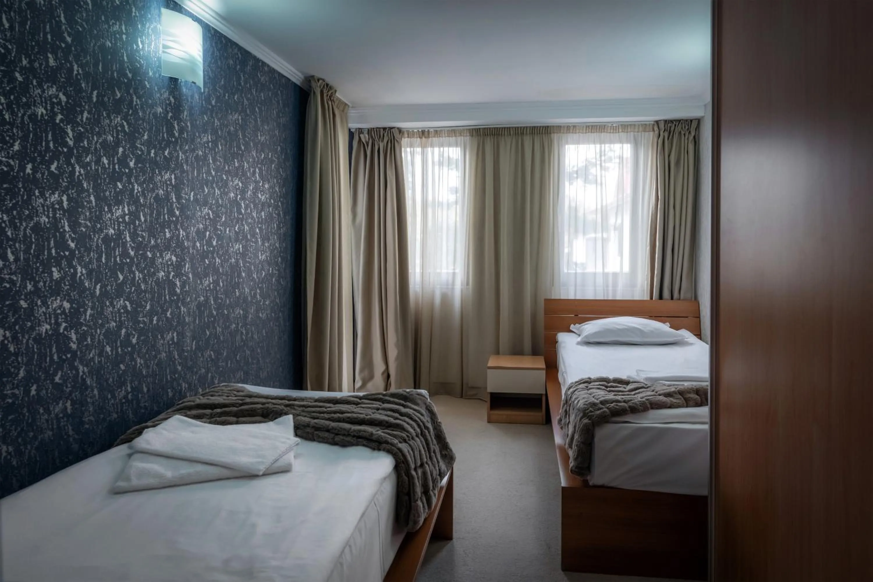 Bed in Snezhanka Hotel Pamporovo - Half Board & Swimming pool