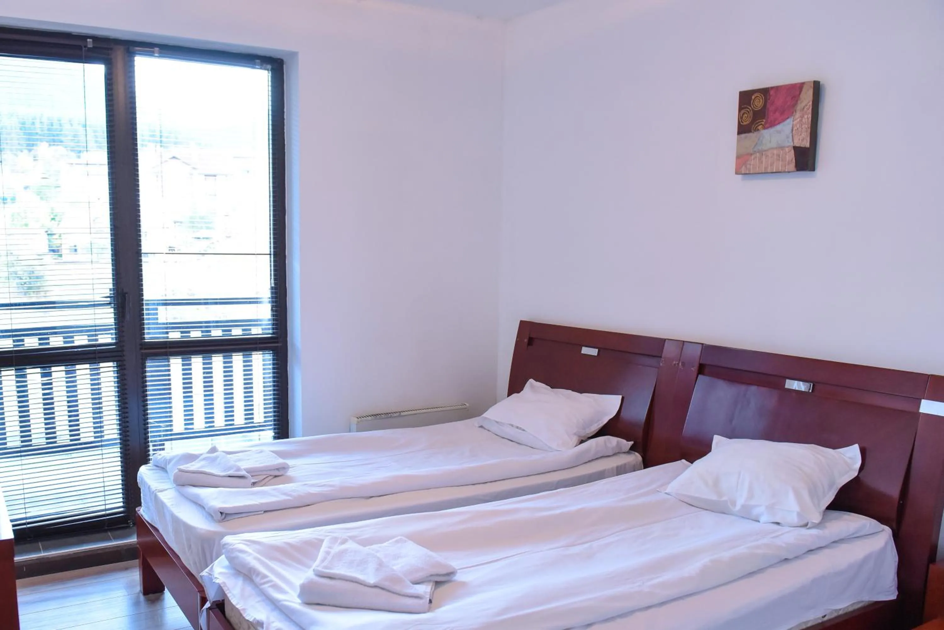 Bed in Royal Bansko - Family Apart Hotel With All Inclusive Light or HB&Drinks and Hot Pool & Jacuzzis