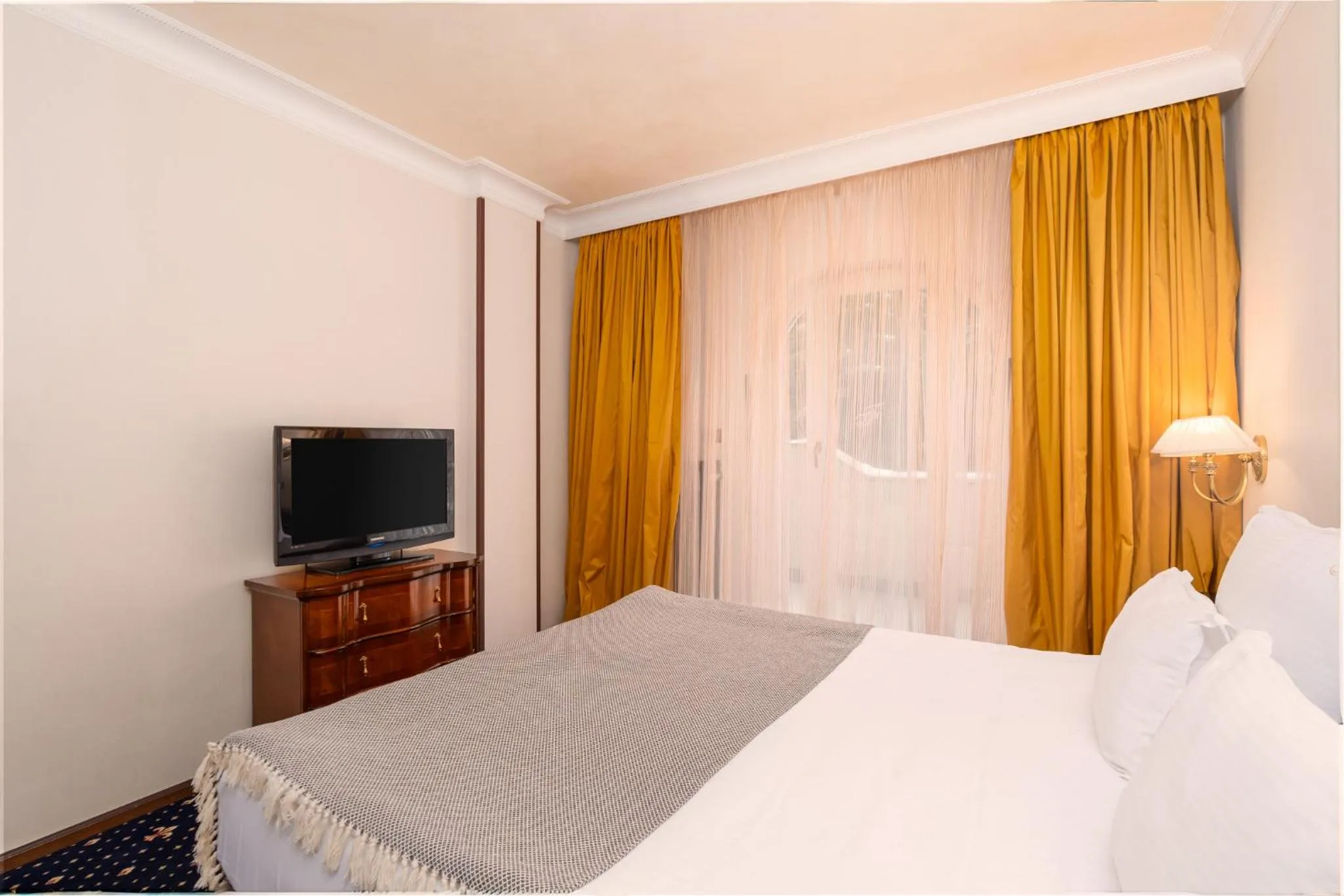 Bed in Festa Winter Palace Hotel