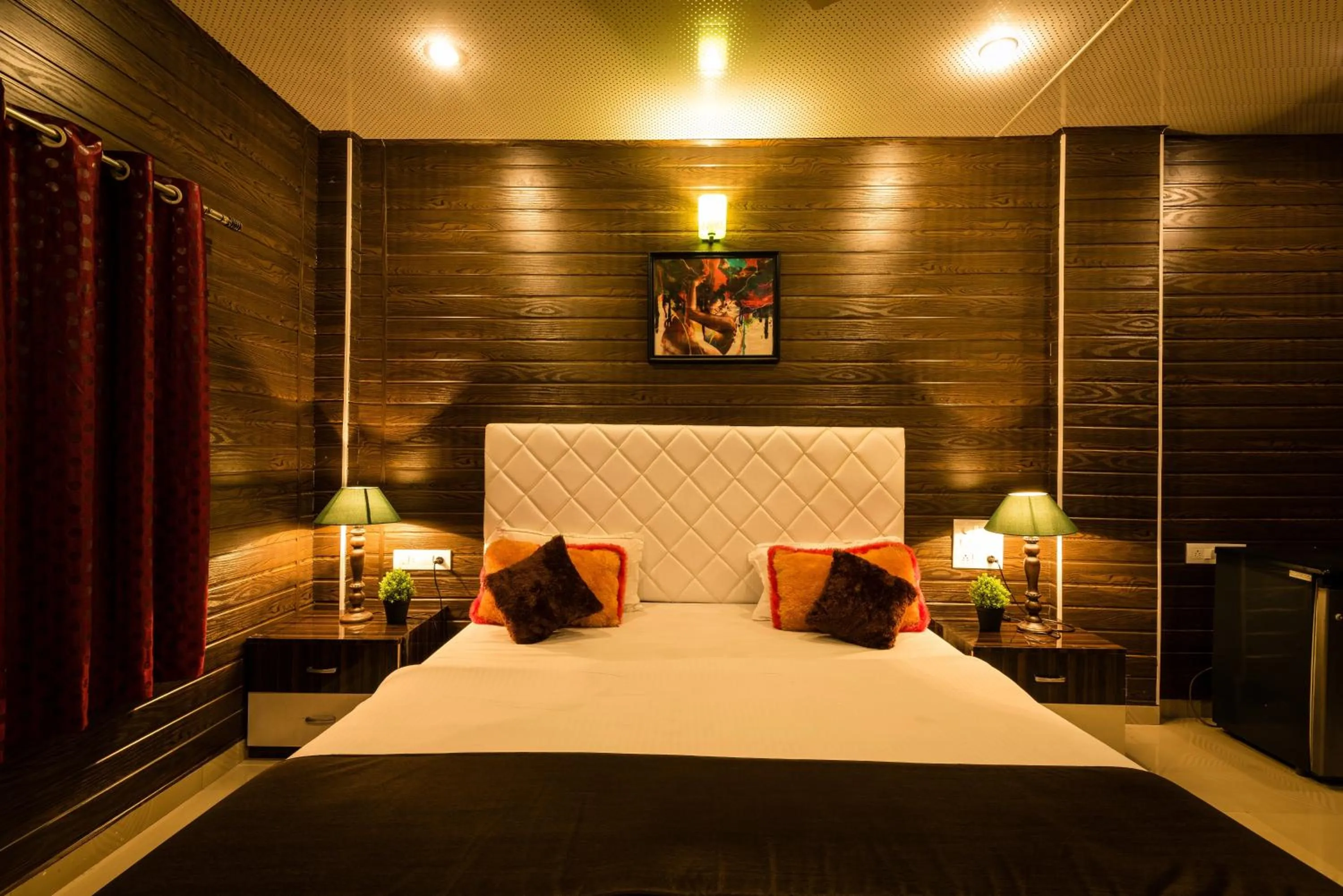 Bed in Sai Atithi Resort