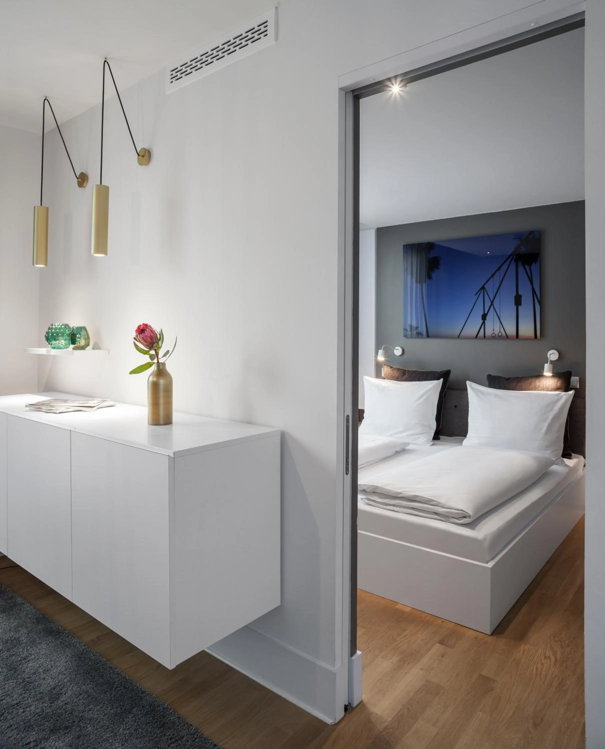 Bed in AMANO HOME Apartments