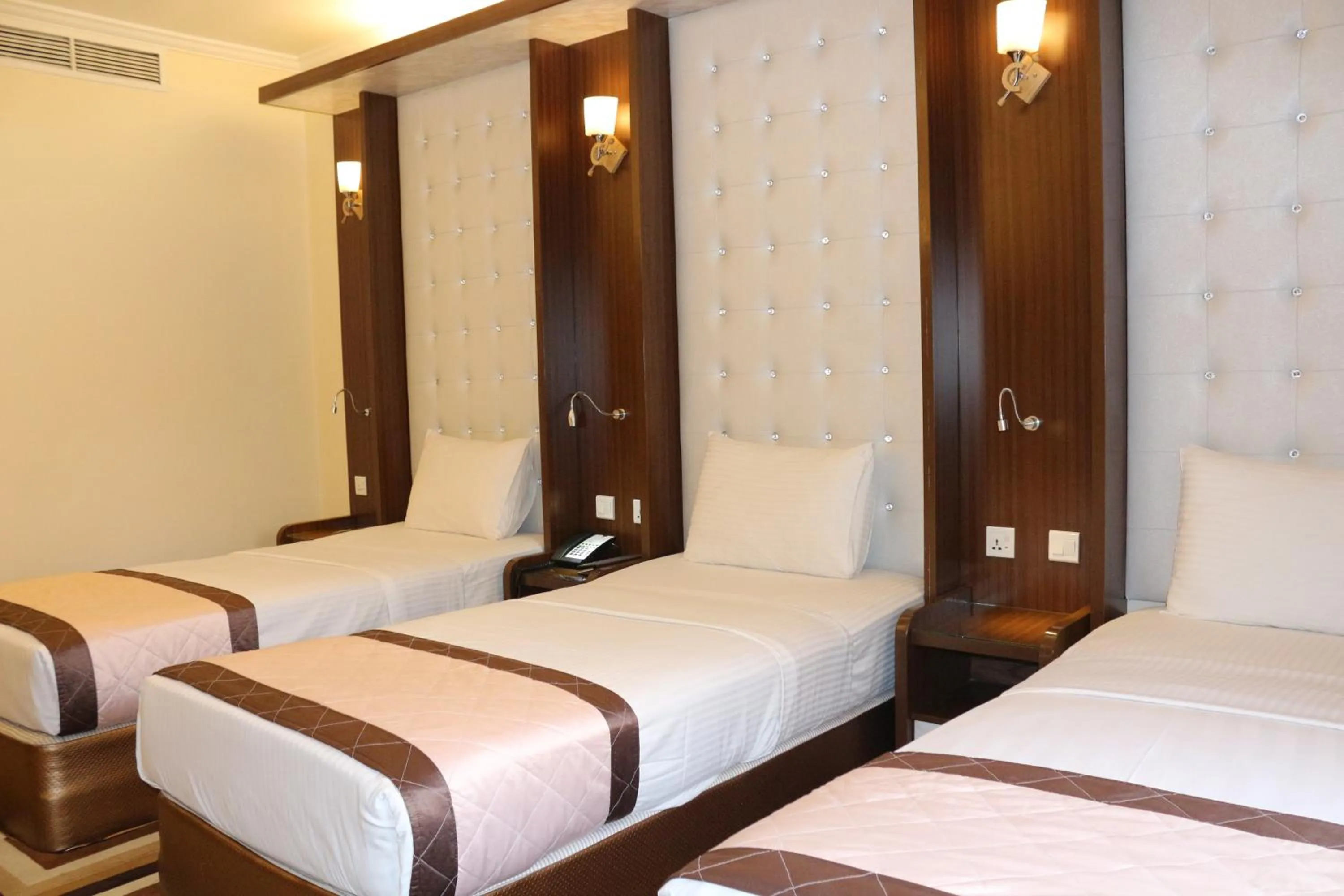 Bed in Al Khaleej Grand Hotel