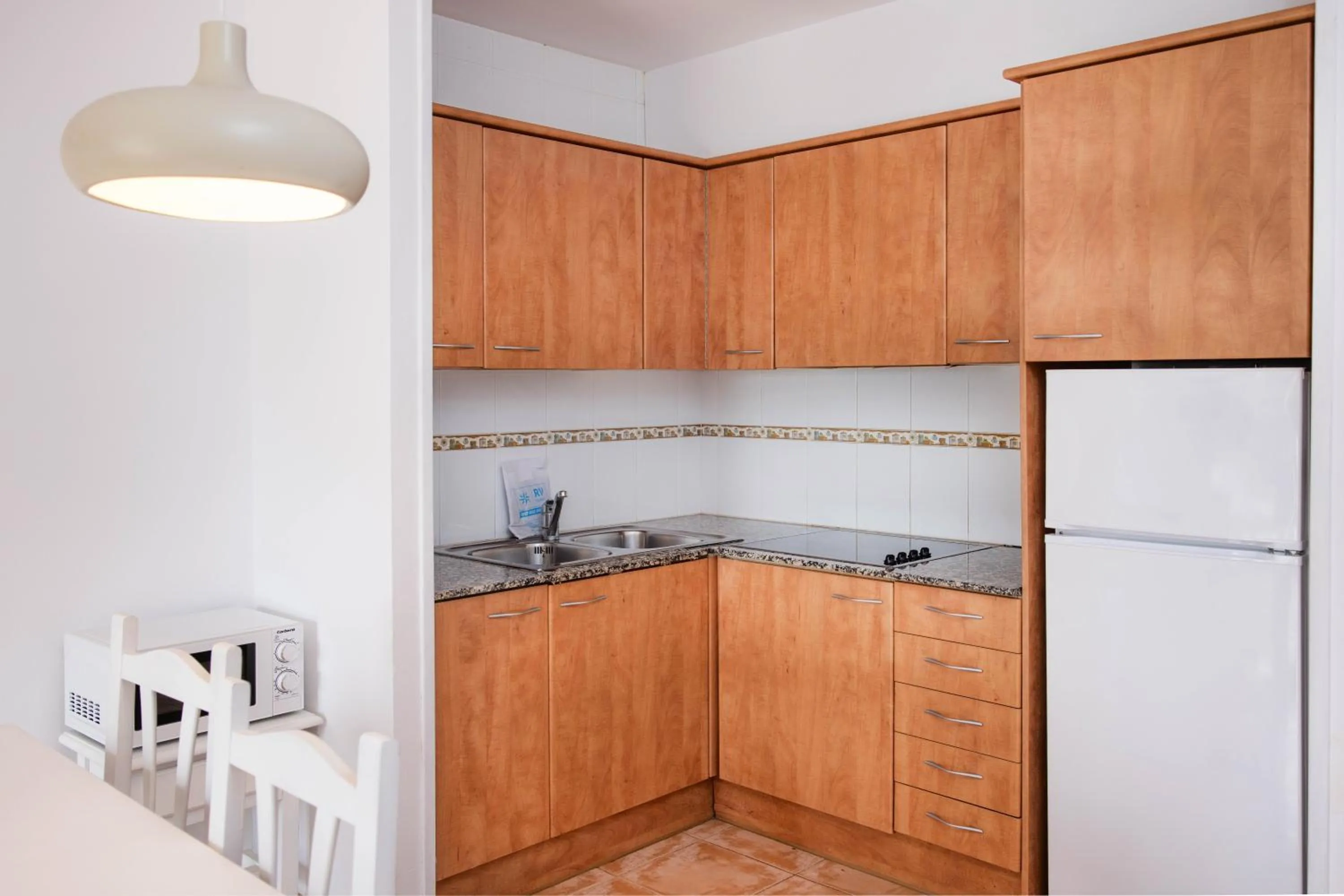 Kitchen or kitchenette in RVApartaments Club Torrevella