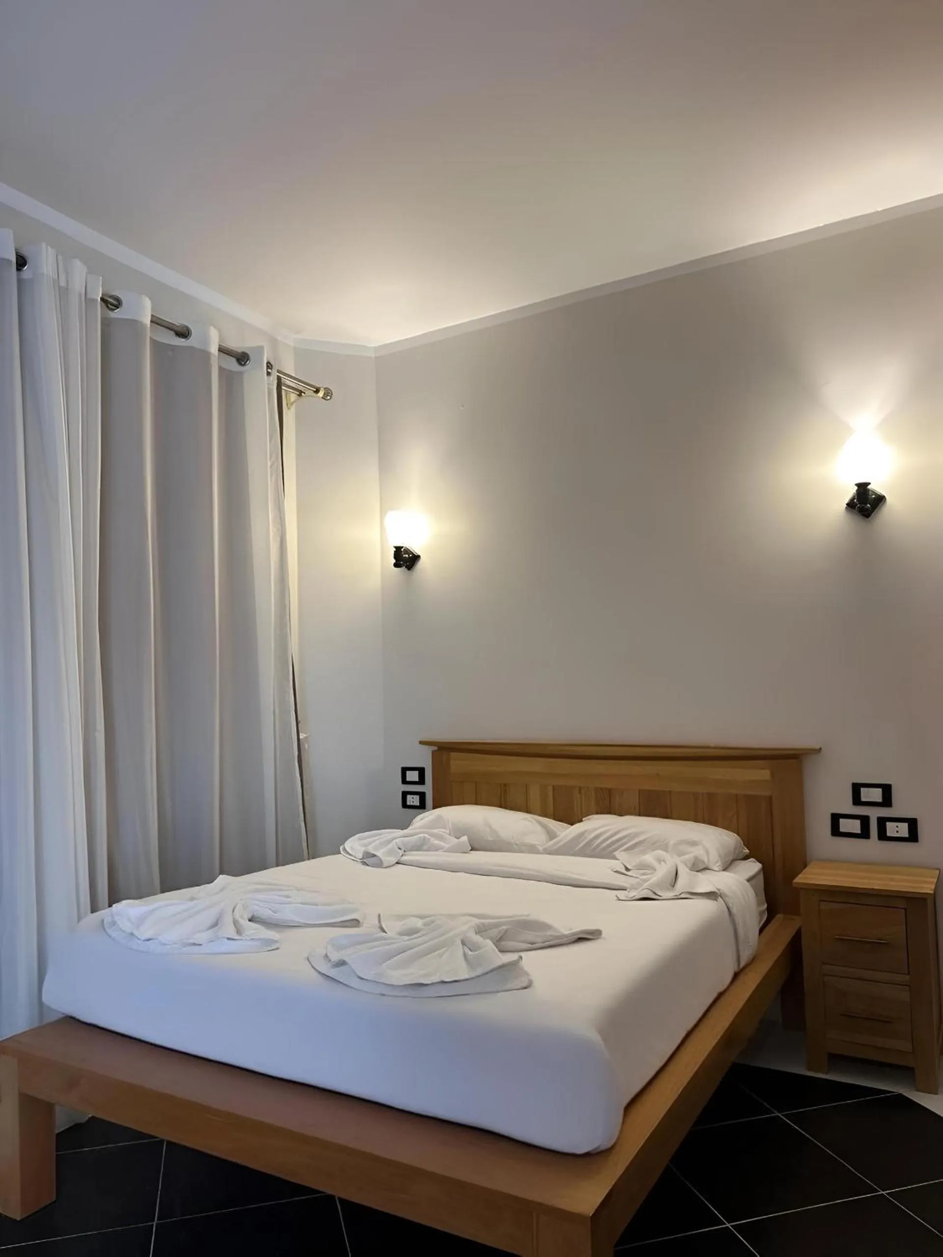 Bed in Royal Beach Serviced Apartments