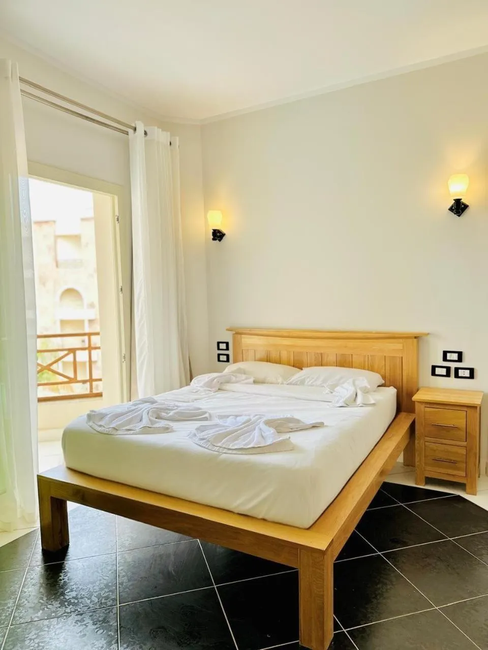 Bed in Royal Beach Serviced Apartments