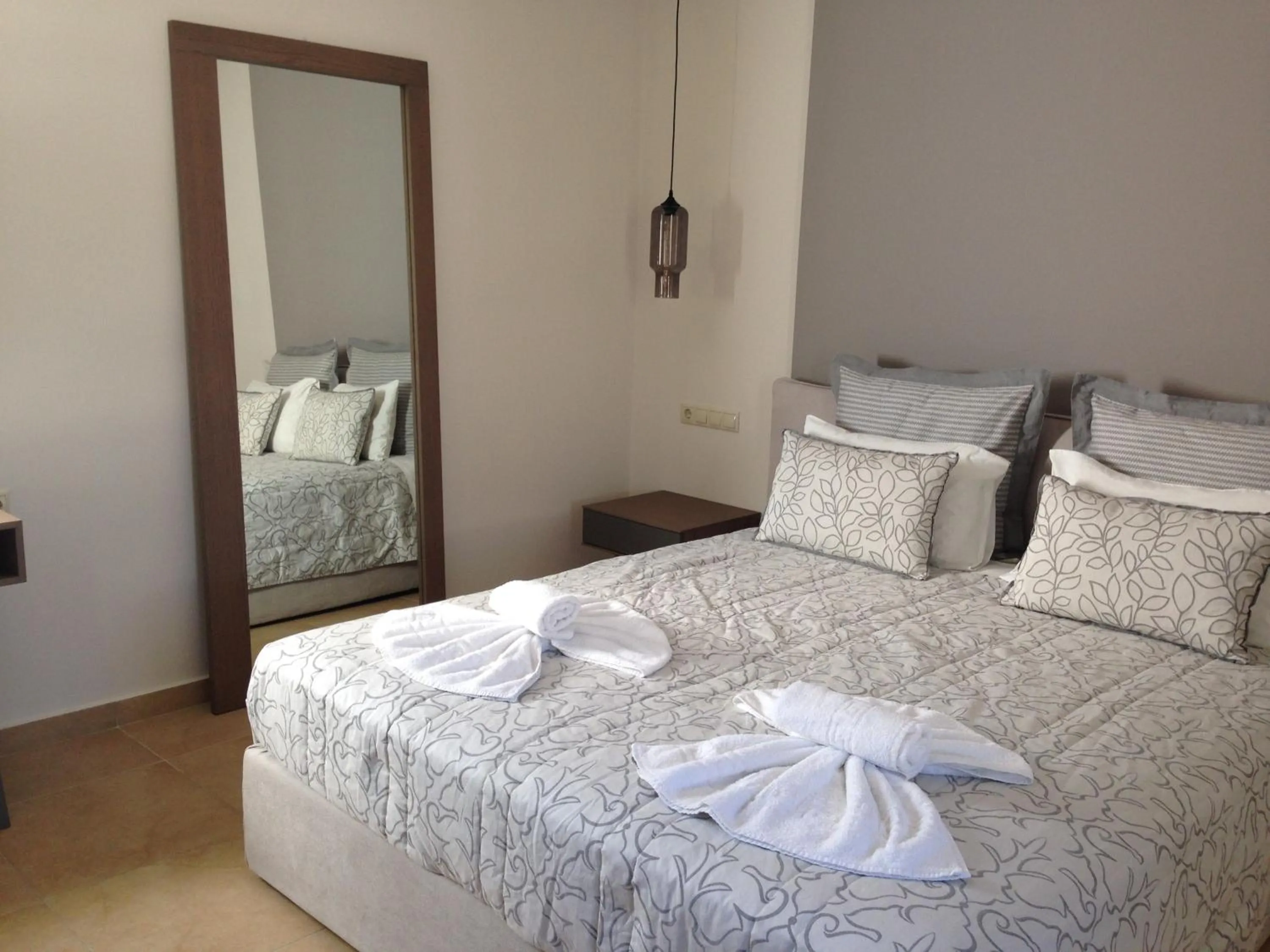 Bed in Anassa Deluxe Suites