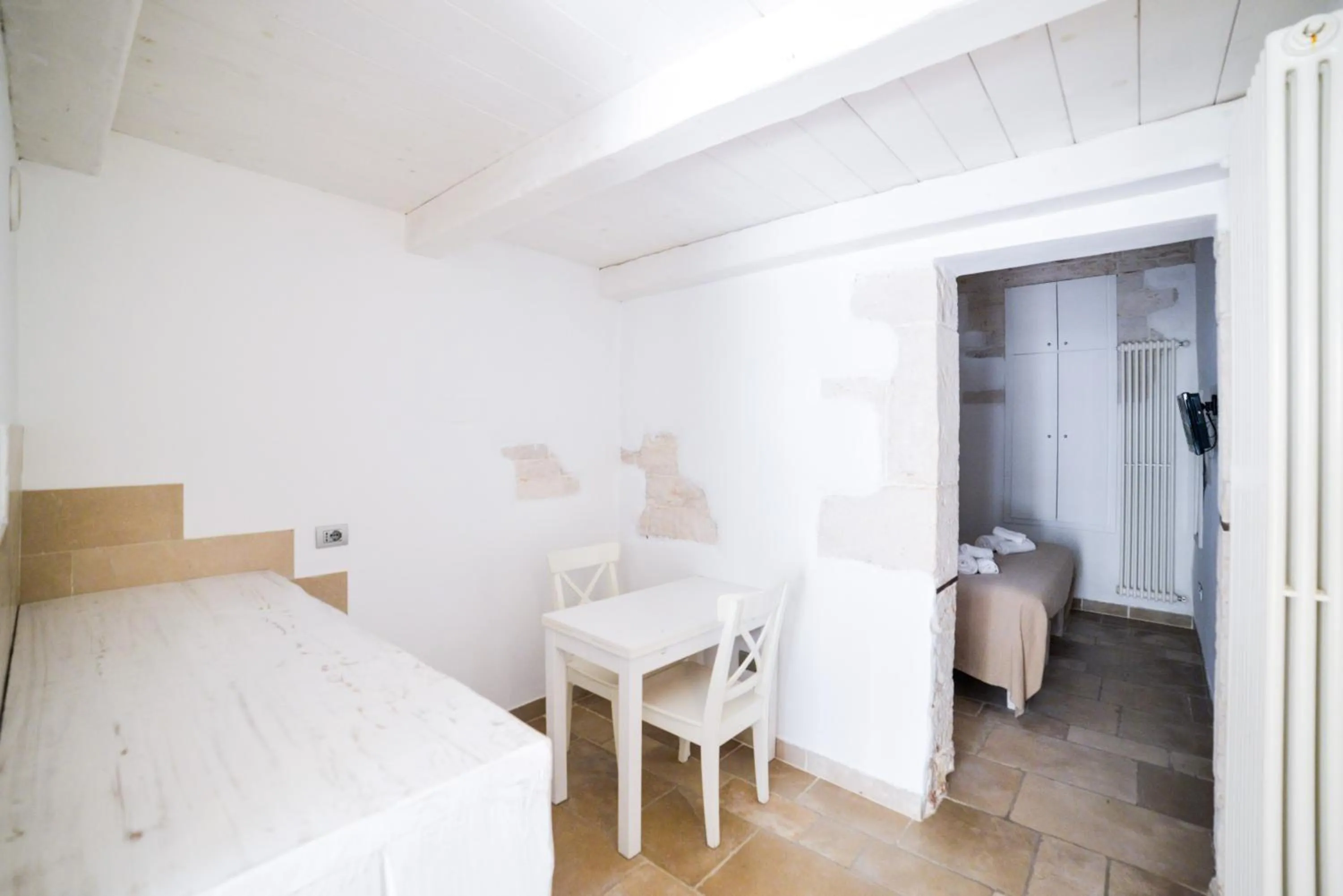Dining area, Bed in Charming Trulli