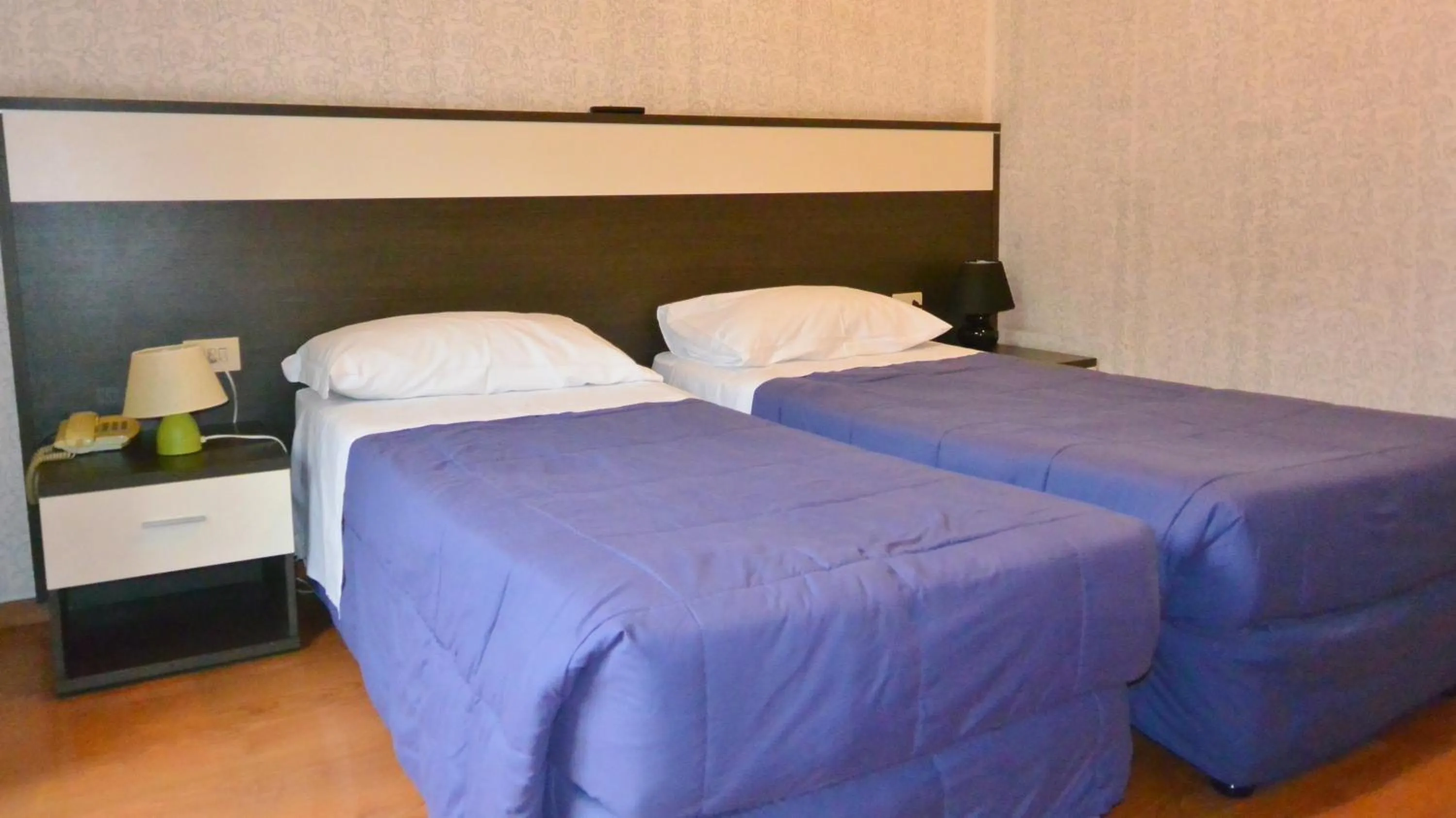 Bed in Hotel Arno
