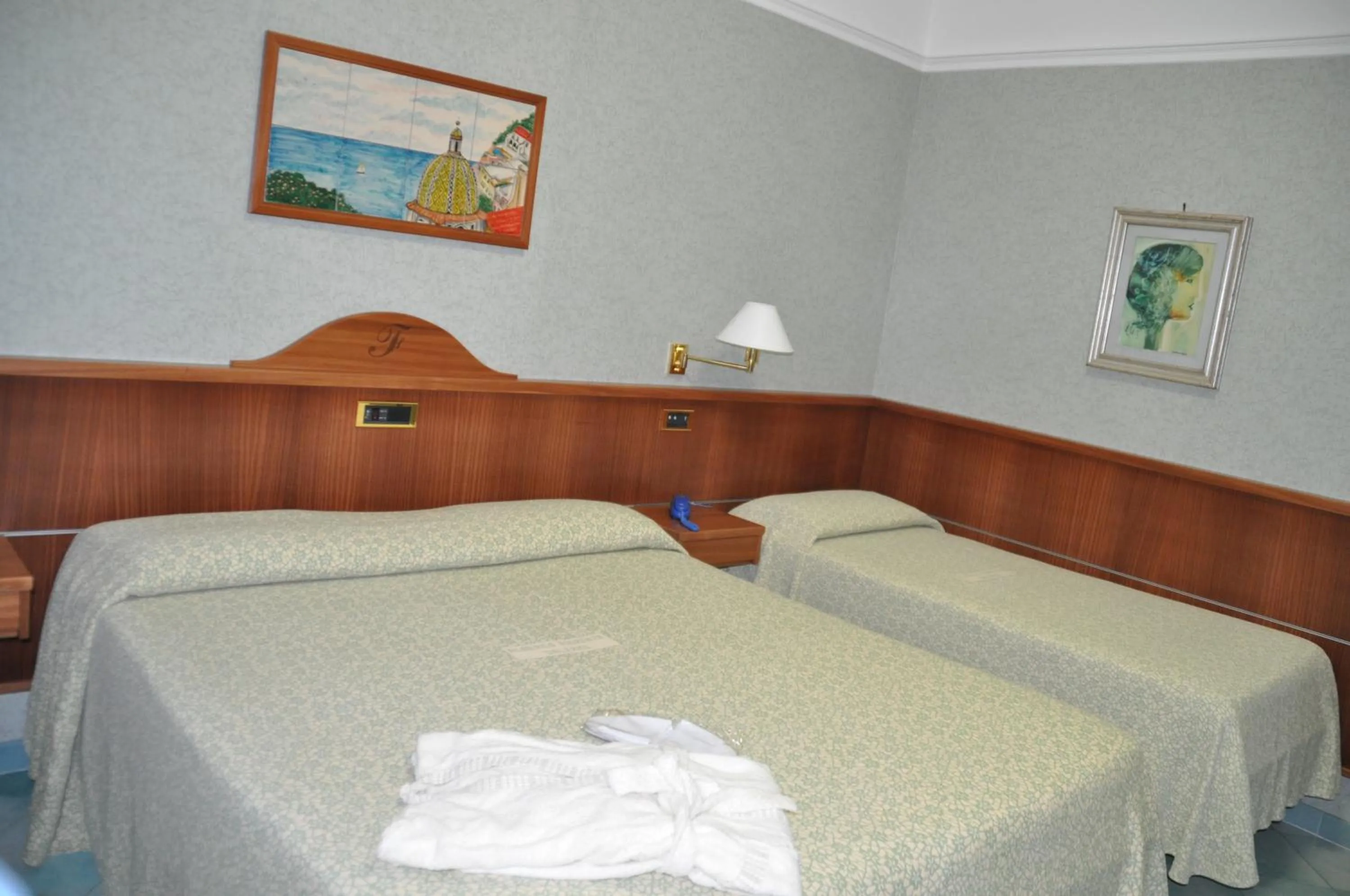 Bed in Albergo Fiorenza